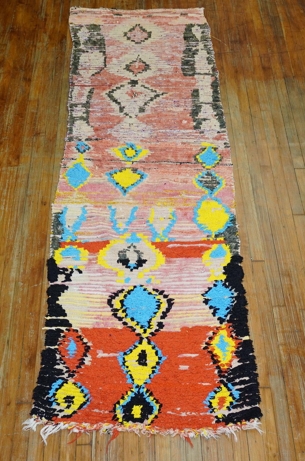 Rare handmade wool one of a kind Authentic Moroccan runner from the middle of the 20th century. The colors and design vary from one end and the other end. This piece is pretty wild and fun. If you are in love take a dive and make a big