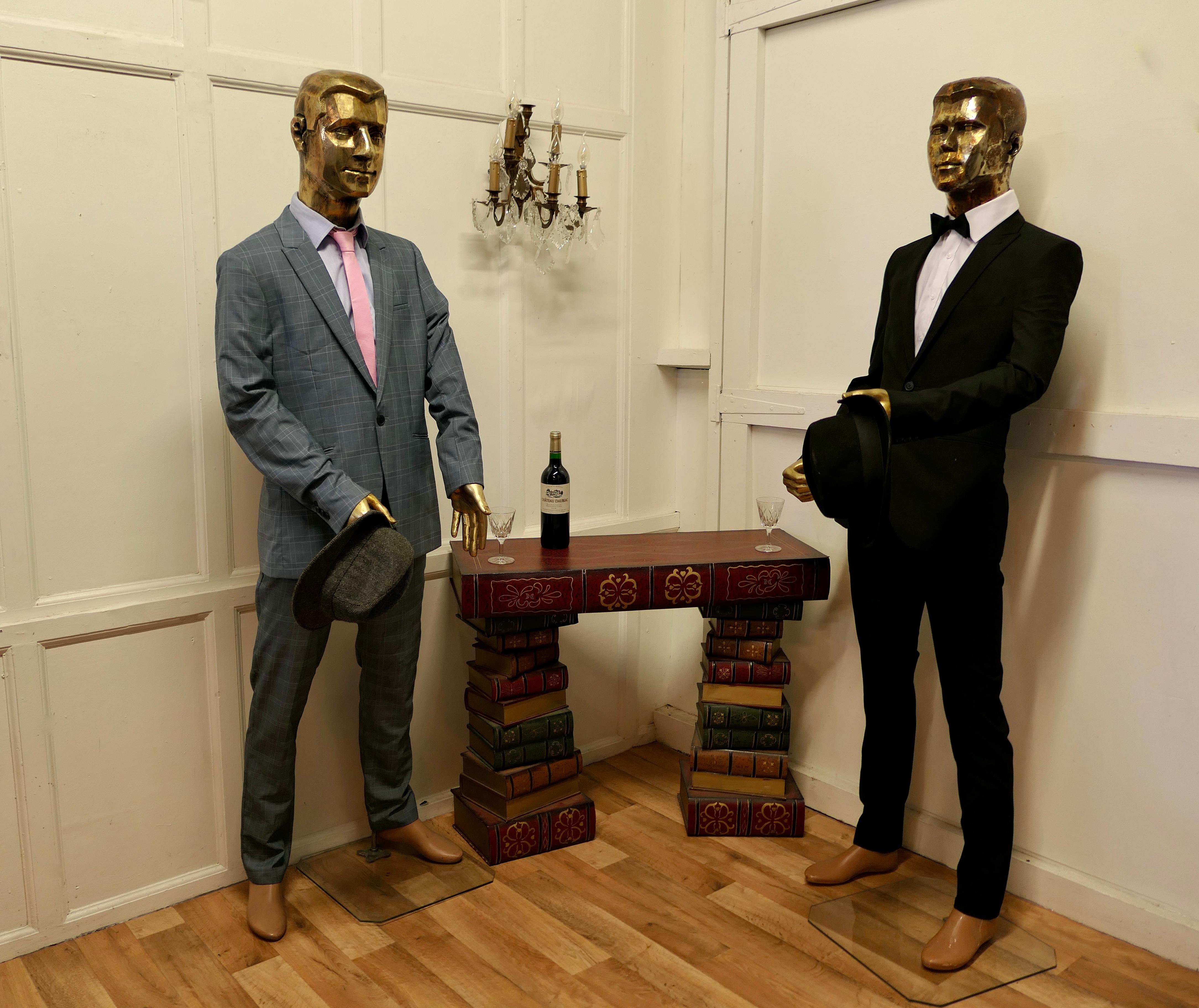 Quirky offbeat vintage male shop mannequin

A Striking Vintage Mannequin with a Gold Head and Hands, he is made in fibreglass with articulated arms
This is a superb quality piece, he is set on a Plate Glass stand he has a large opening in his