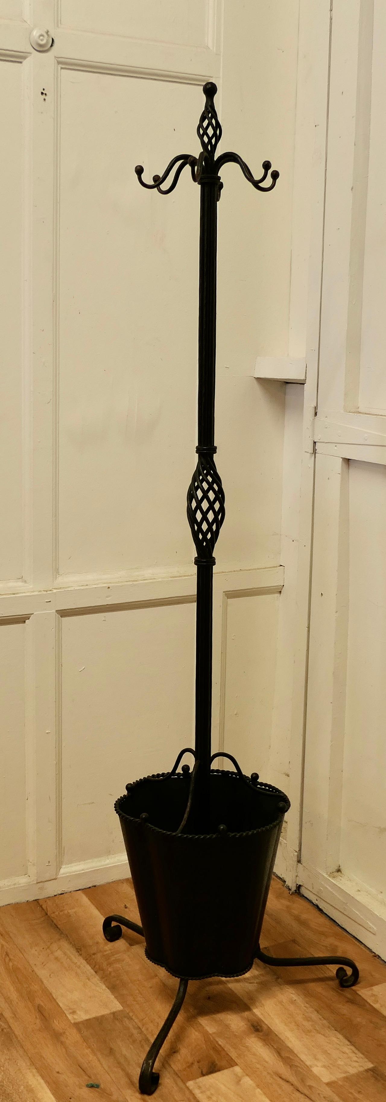 Quirky retro wrought iron hall stand, hats coats and umbrellas 

This is an Unusual Hat & Coat Hall Stand it has Large Hat and Coat pegs at the top, and lower down there is a 4 section holder for umbrellas, in the shape of a giant Umbrella
The