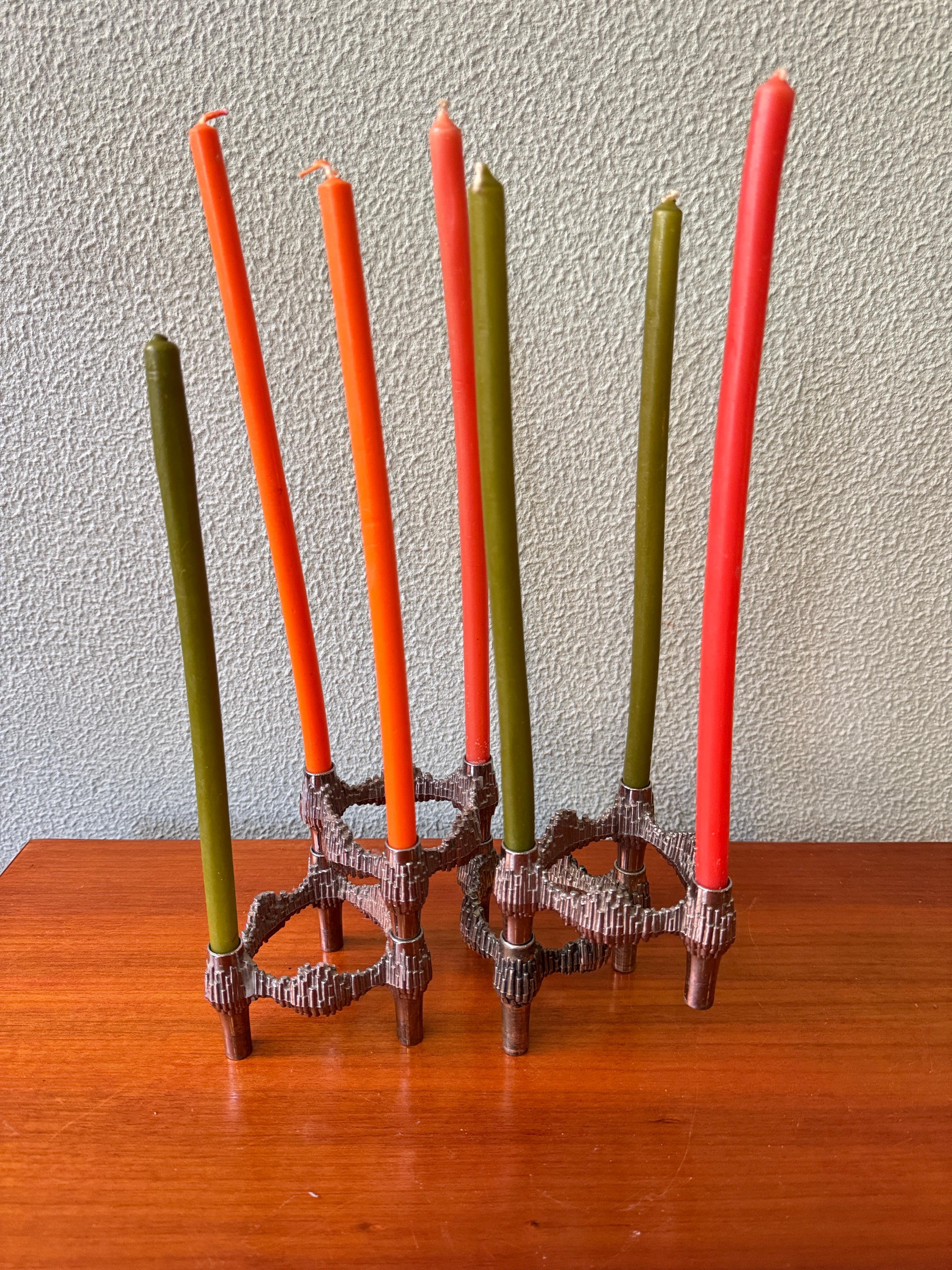 This set of four Variomaster modular candle holders was produced in the 1970s by Quist, a German manufacturer known for its bold interpretation of Brutalist design in small metal objects. Closely related in spirit to the well-known BMF Nagel system