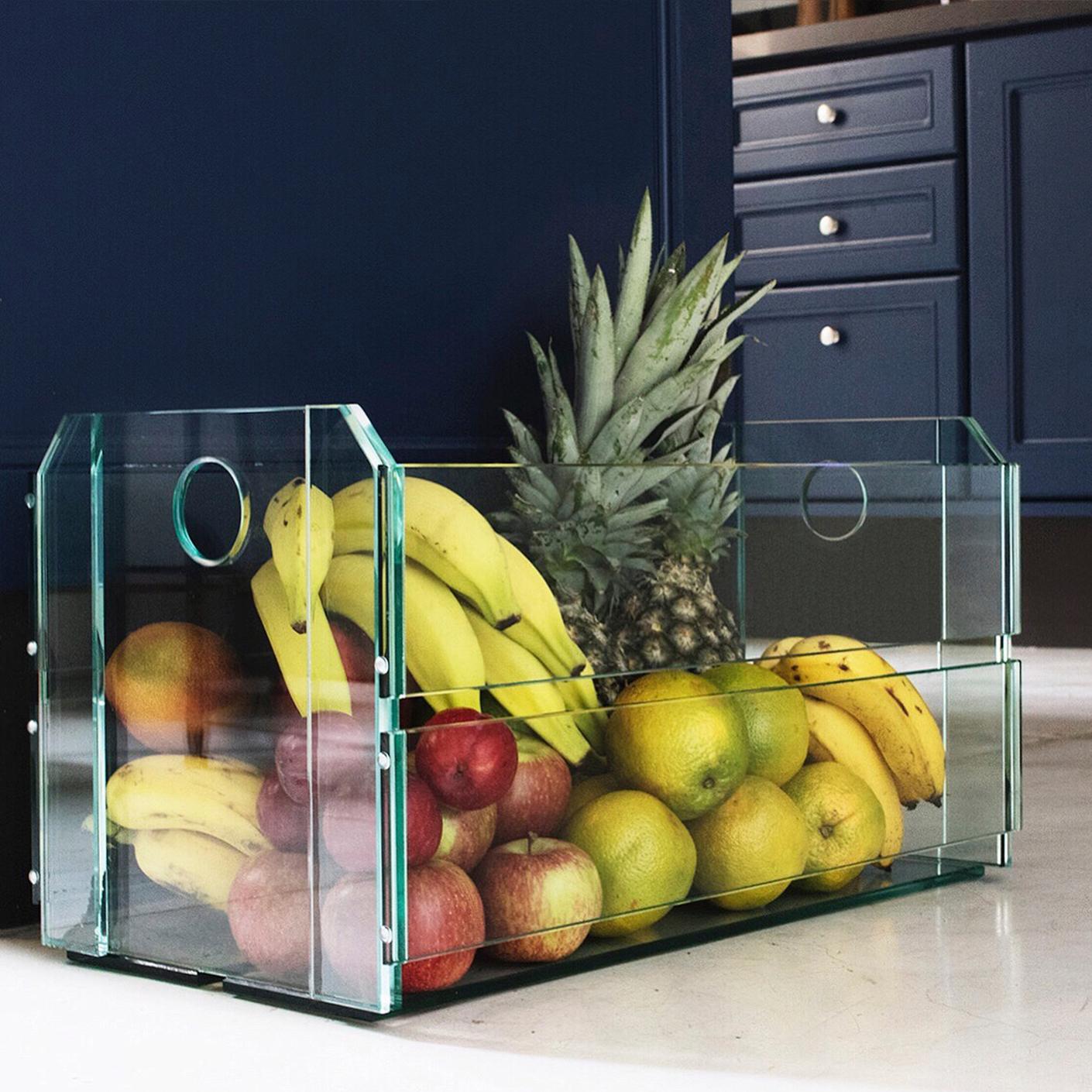To perpetuate the memorable wooden boxes at fairs in Brazil, the architect and designer Tiago Curioni, a Brazilian based in Portugal, recreated the glass boxes, in a limited series of 30 units.

Named as Quitandeira, it has a system of glass