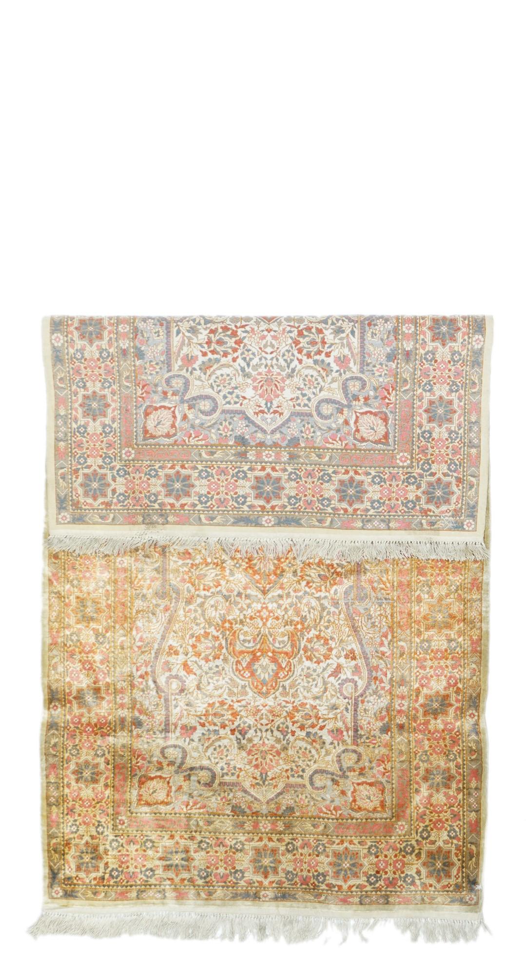  In the Persian Kashan style, this extremely fine ruglet shows a light palette including: beige, rust, teal and straw. Tall pointed elliptical medallion on a beige field with looped beige corners. Main border with octogrammes. As new condition.