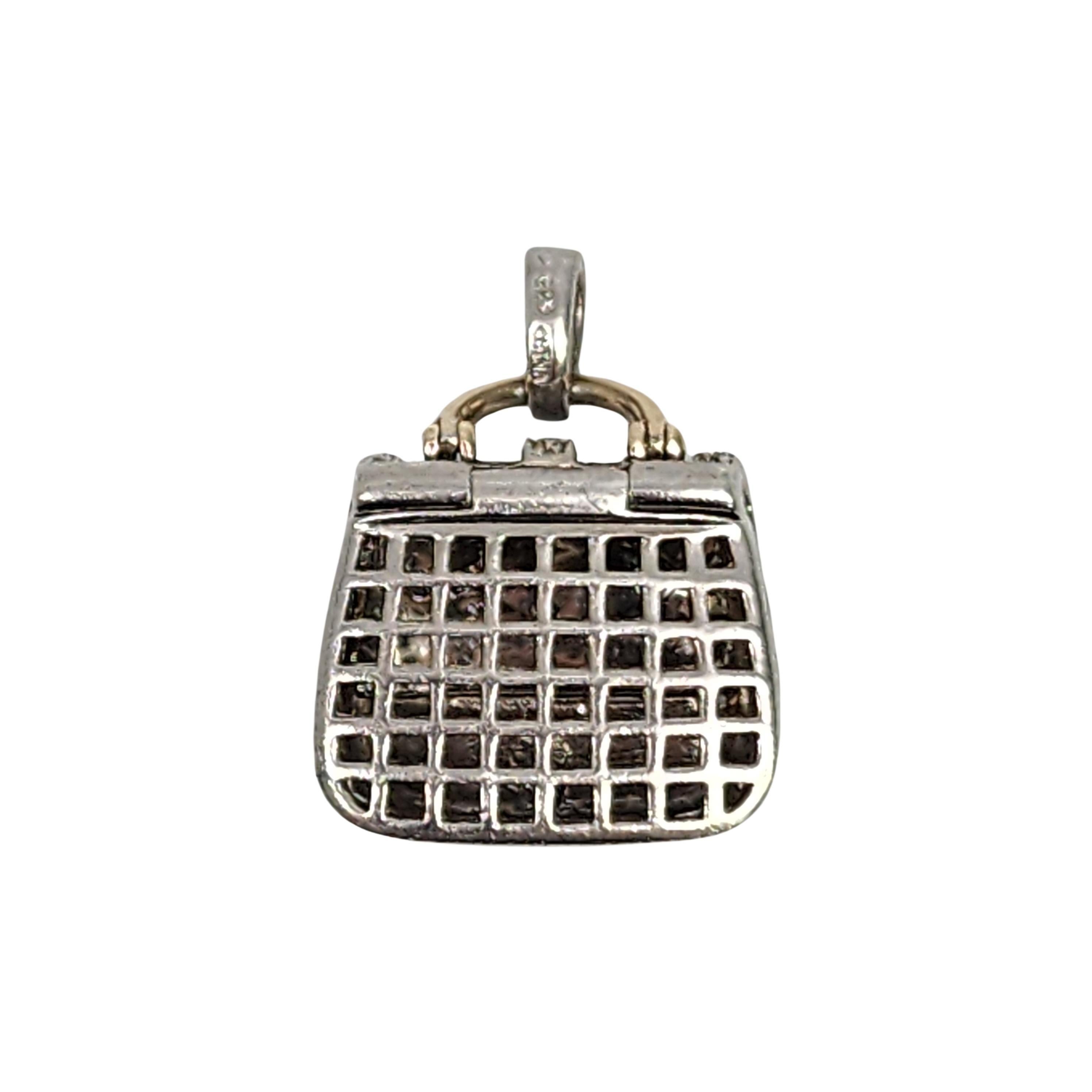 QVC's Affinity diamond sterling silver gold accent purse charm.

Sterling silver quilted design purse charm with gold accented handle and buckle with diamond accents. The front of the purse flap opens.

Weighs approx 10.6g, 6.8dwt

Measures approx 1