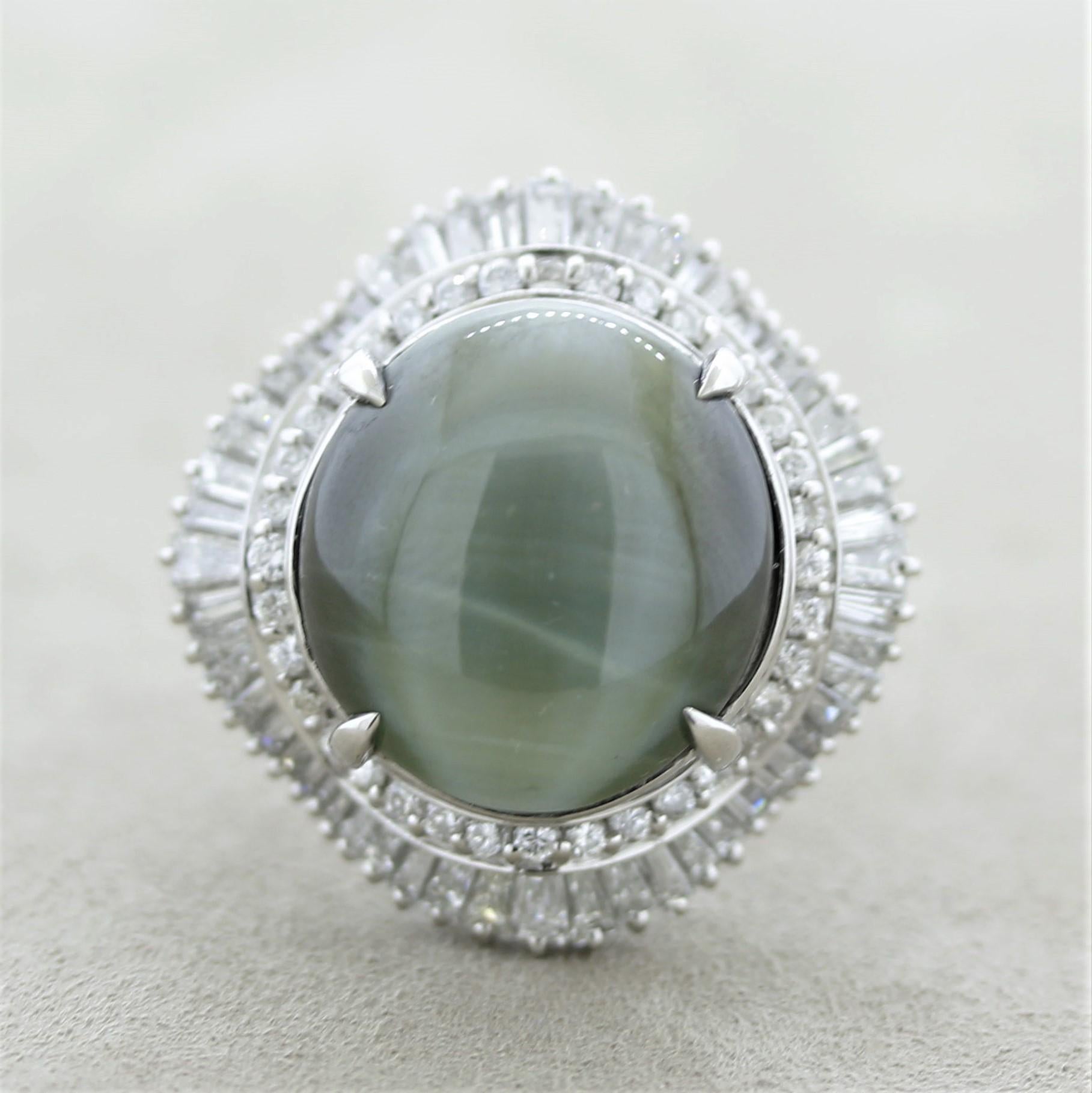 A large and substantial cats eye chrysoberyl takes center stage of the platinum cocktail ring. It weighs an impressive 38.85 carats! It has strong chatoyancy (cats eye effect) when a light or direct sunlight hits the top of the stone. It is accented