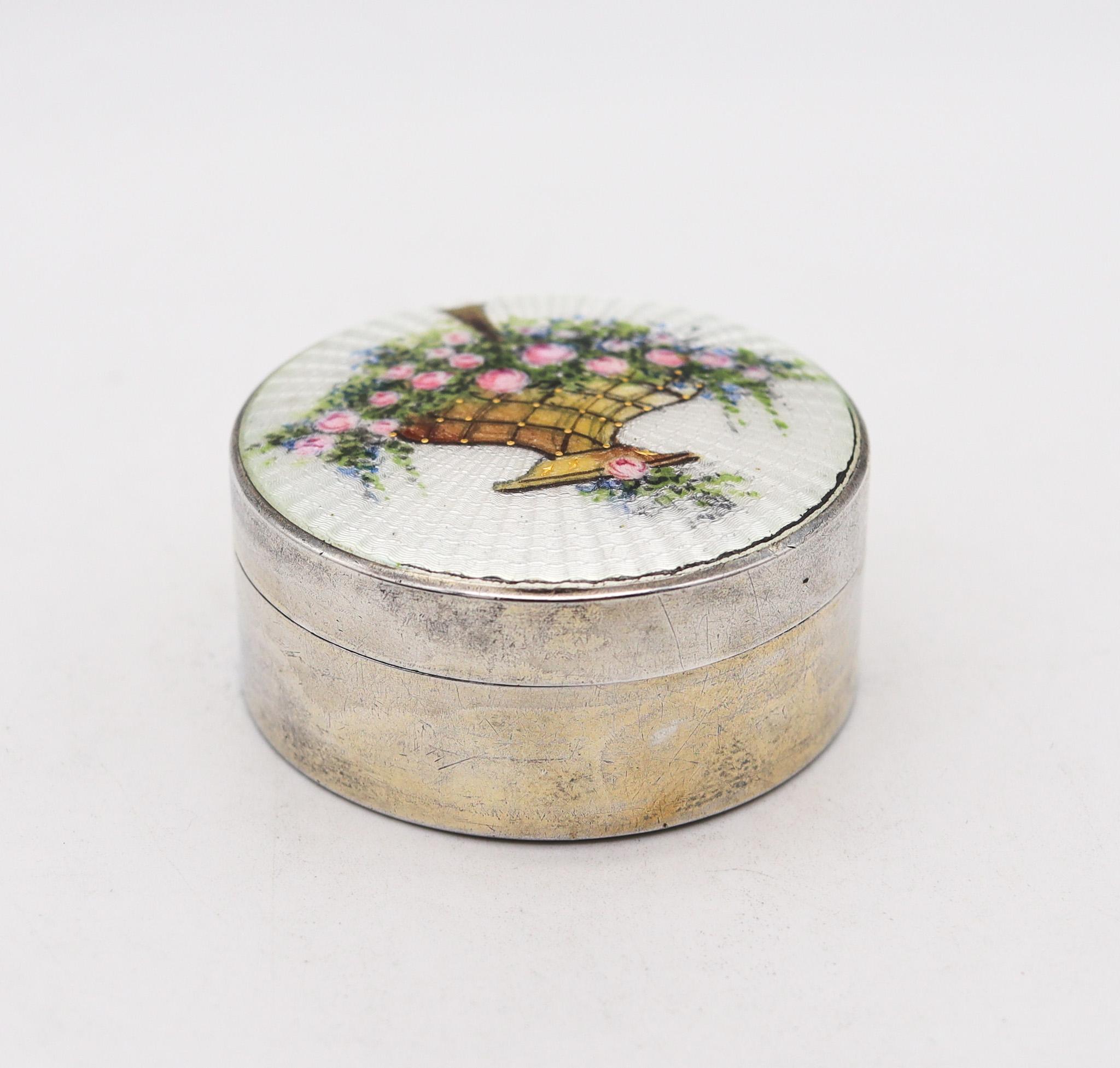 A guilloche enameled round box designed by R. Blackinton.

Beautiful early 20th century enamel box, created by the Ross Blackinton Company Silversmiths & Goldsmiths, circa 1910. This beautiful Edwardian box was carefully crafted with impeccable