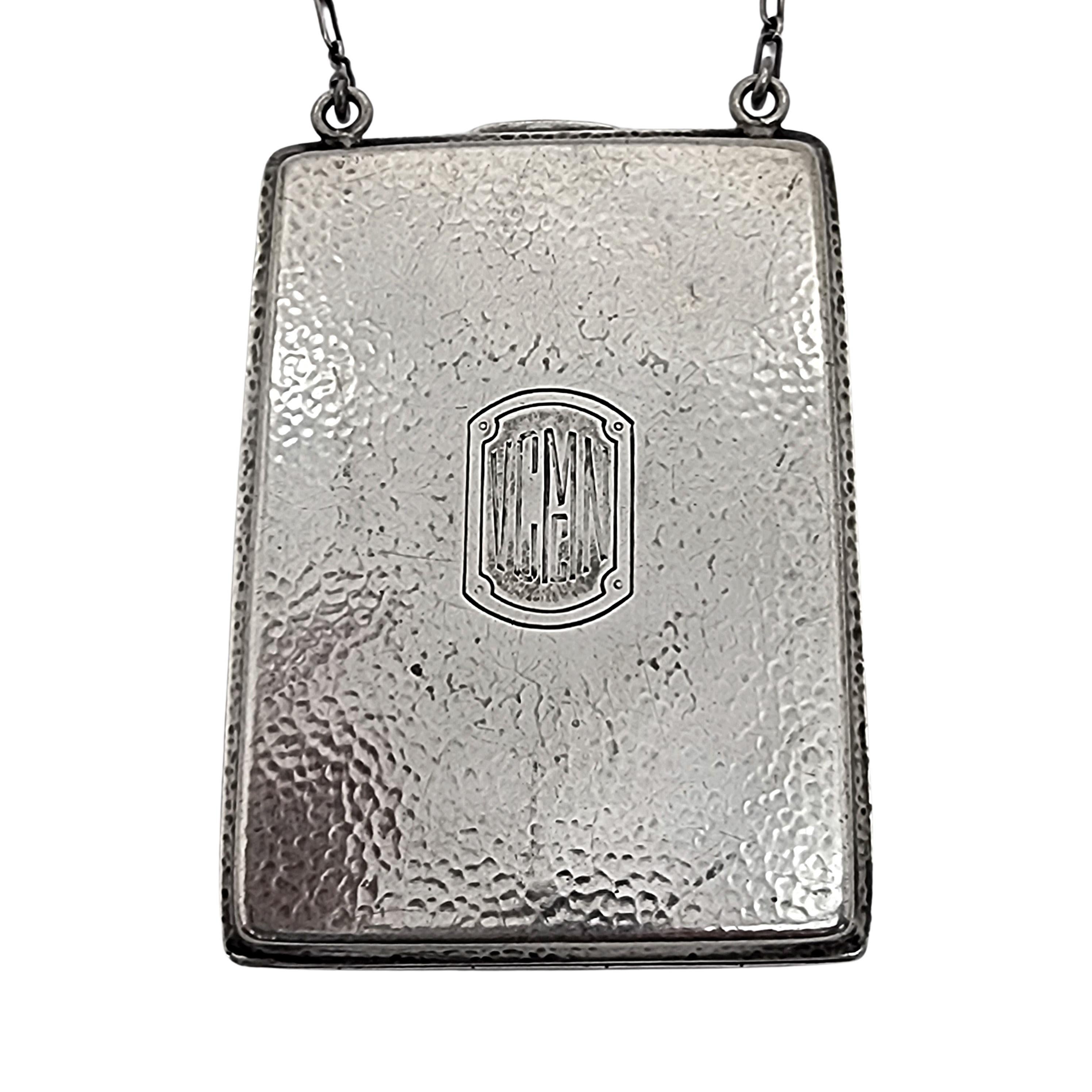 sterling silver coin compact purse, pattern # 7043, by R Blackinton & Co with monogram.

Monogram appears to be VCMcN

Beautiful simple, classic and timeless hammered design with a chain strap. Cartouche with monogram on the front. Push button