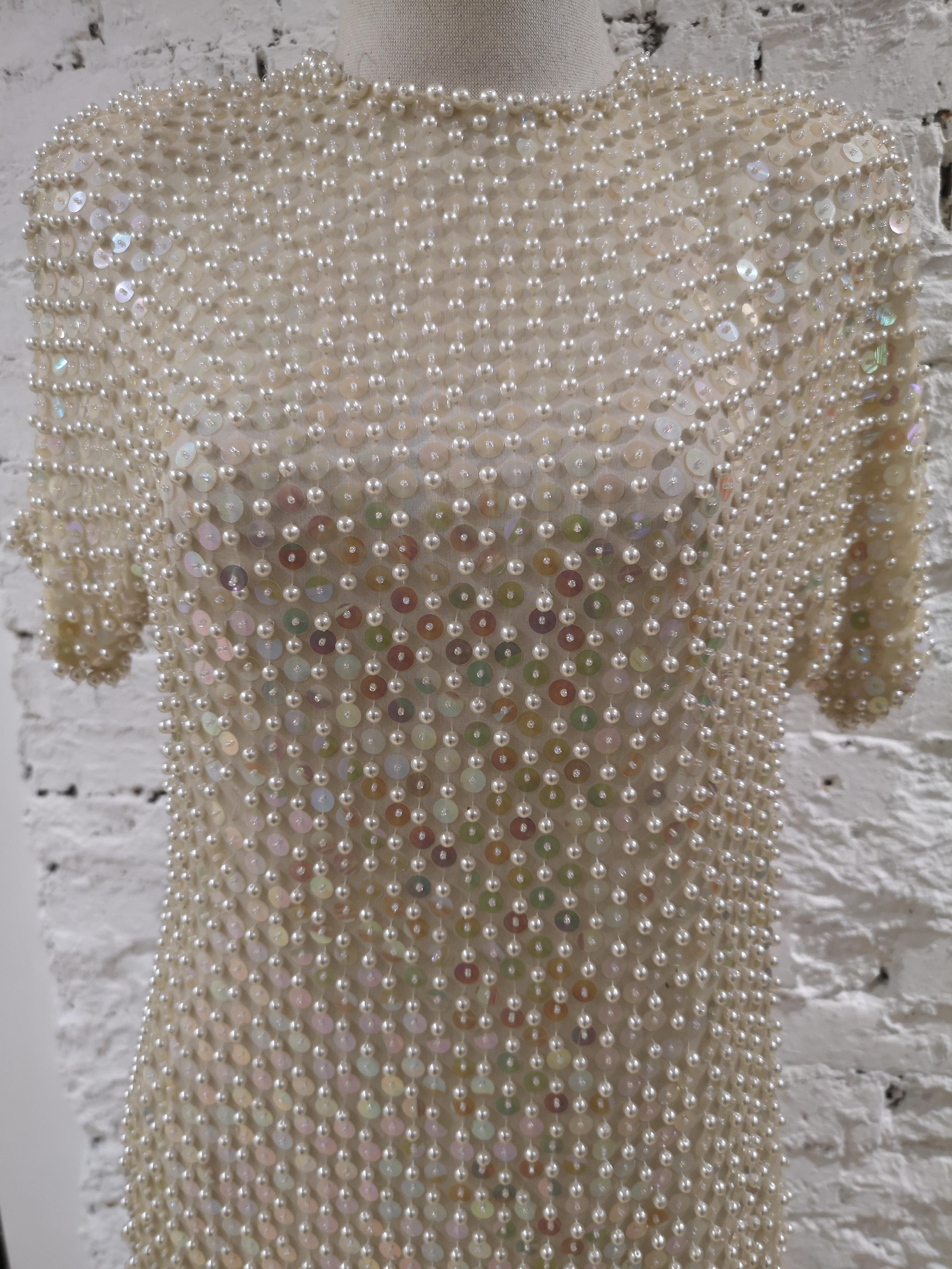 R. Carrano cream beads dress
Size 10
still with original tag, some beads are missing