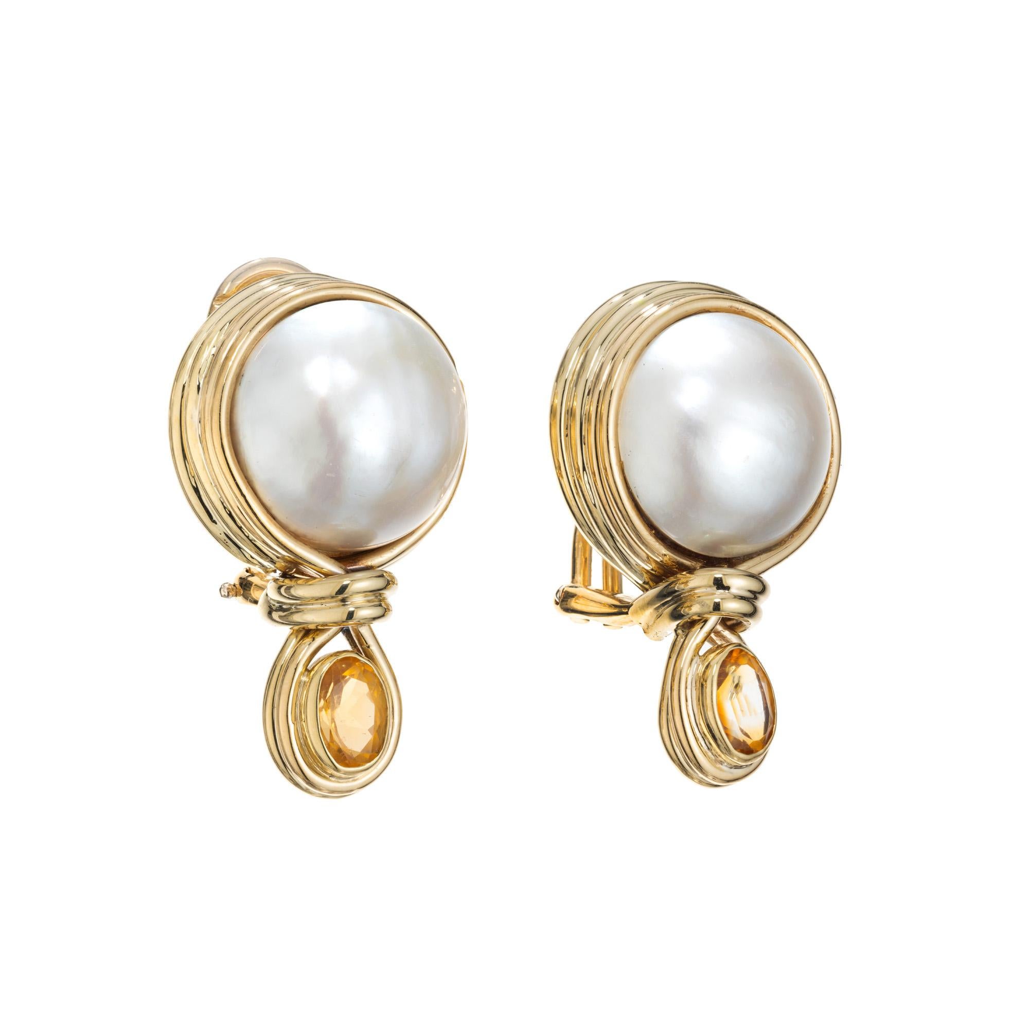 Authentic R Cipullo hand made pearl and citrine clip post earrings. 2 round cabochon white mabe pearls set in 18k yellow and wire settings. Each pearl is accented with an oval citrine. Beautifully crafted by iconic Italian jewelry designer Renato