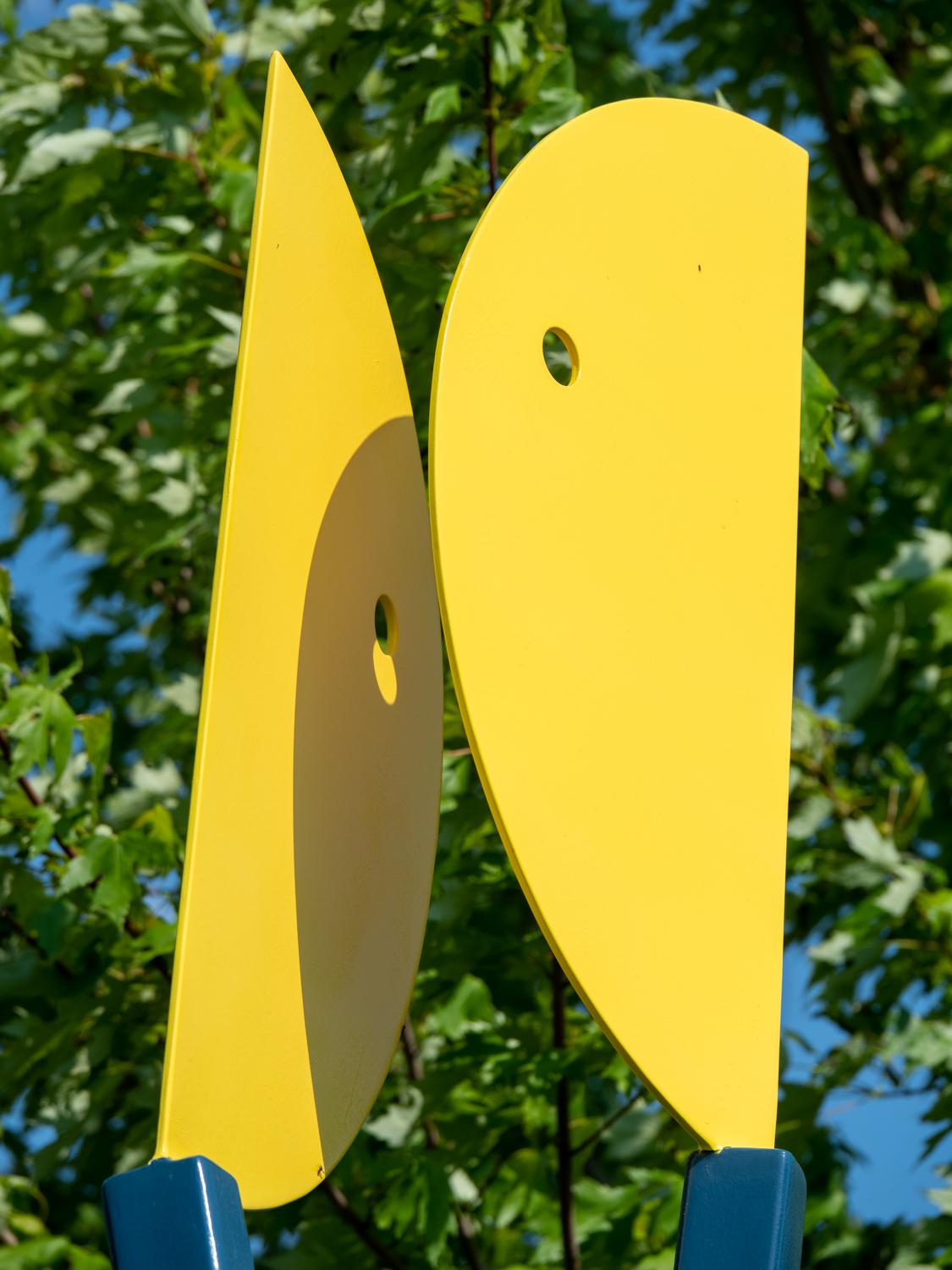 Colourful. Engaging. Minimalist. Theatrical. That describes the work of Robert Clarke-Ellis. The Toronto sculptor creates accessible pieces that although playful in form often speak to serious values. This piece features two abstract shapes forged