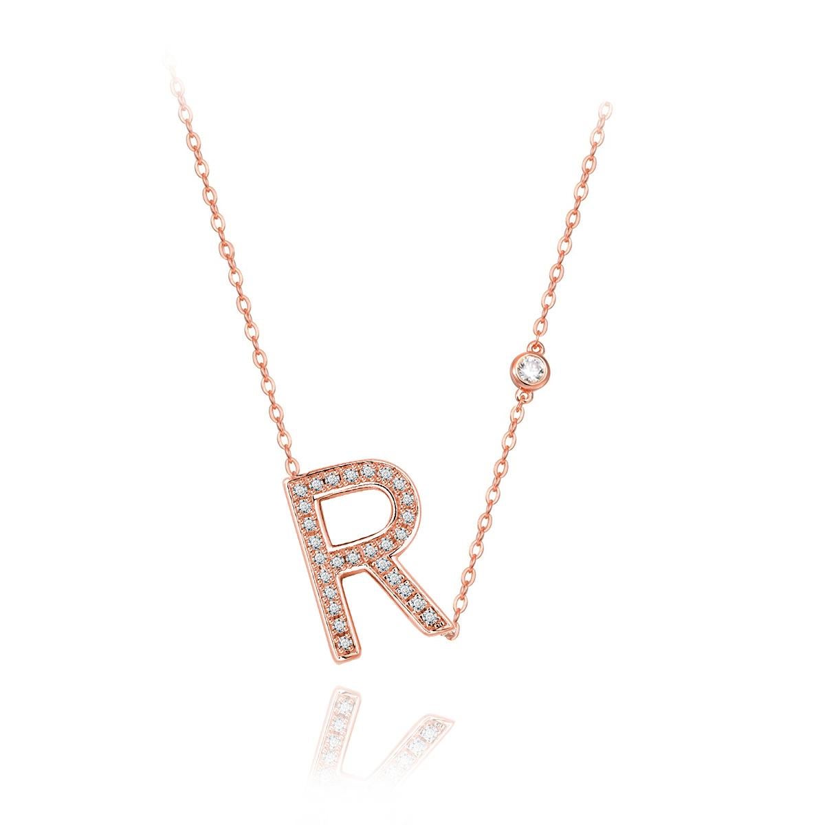 Nothing says YOU more than YOU. You are unique. You are bold. You're not afraid to share who you are. This initial bezel chain necklace is elegantly slimline while sharing a little bit about yourself with others. .925 sterling silver base also