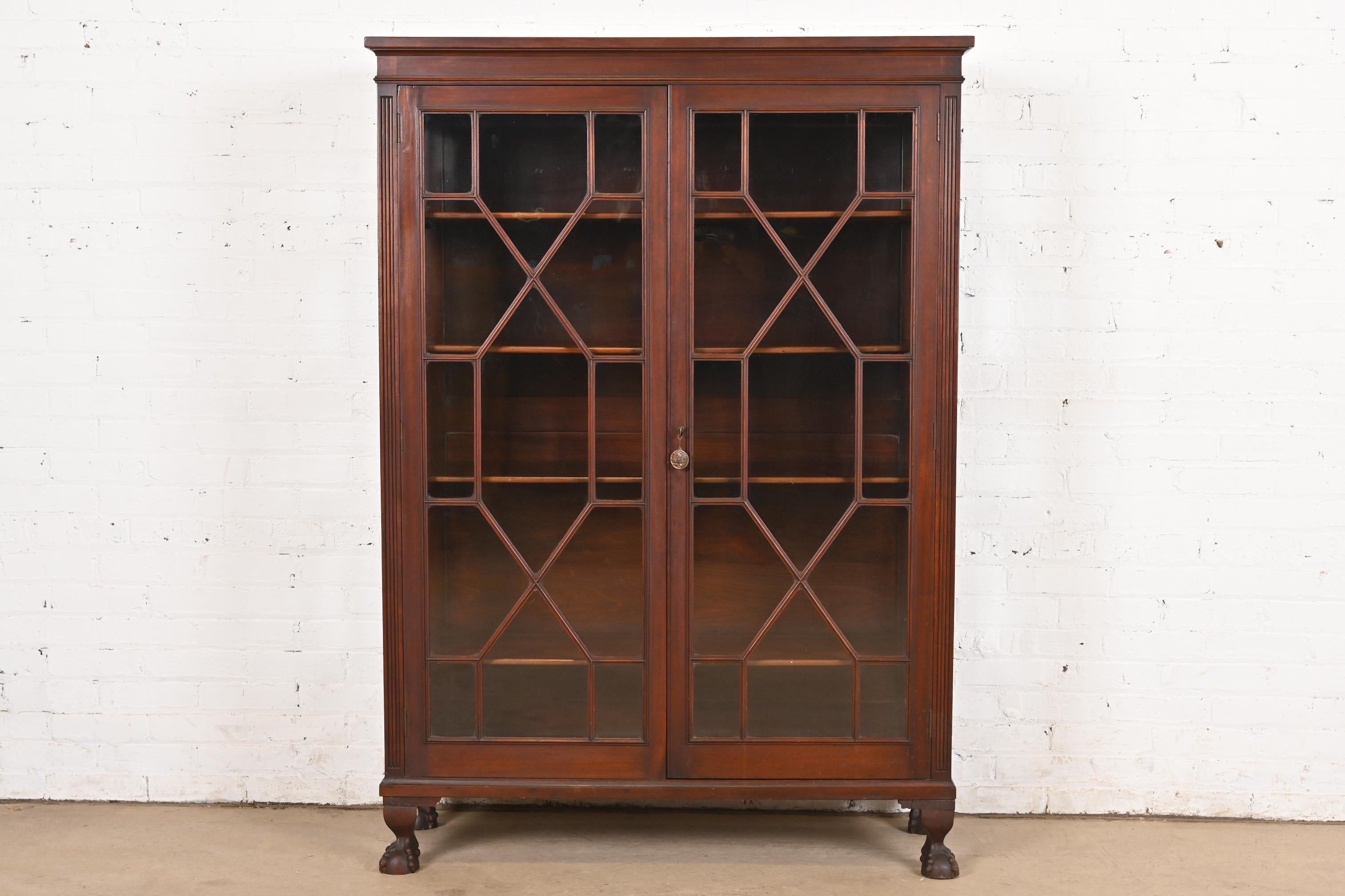 R. J. Horner Style American Empire Carved Mahogany Bookcase, Circa 1890s en vente