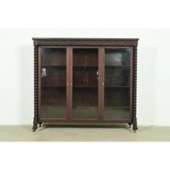 R. J. Horner Style American Empire Carved Mahogany Triple Bookcase, Circa 1890s