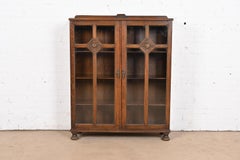 R. J. Horner Style Antique English Tudor Carved Oak Glass Front Double Bookcase