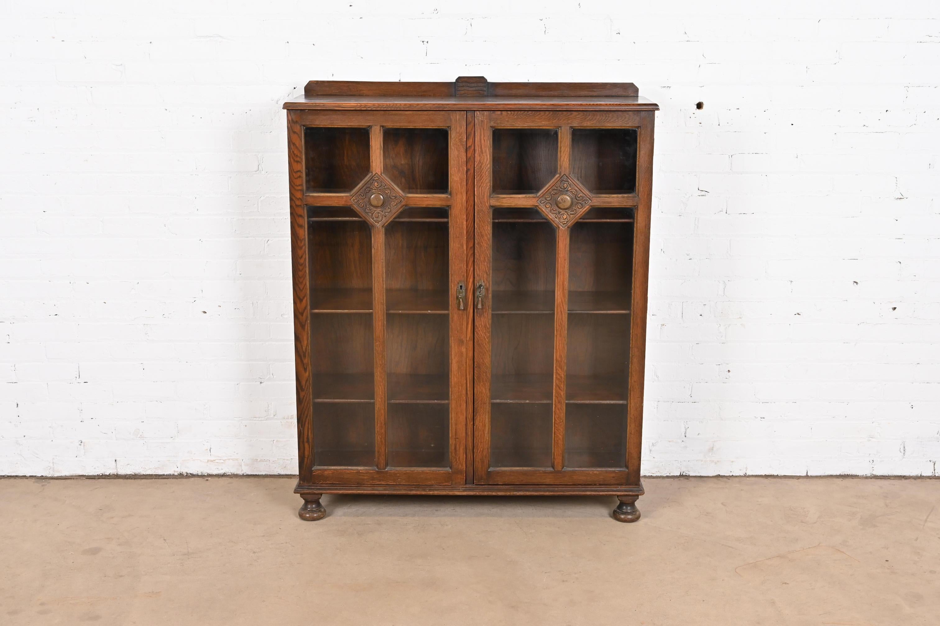 Victorian R. J. Horner Style Antique English Tudor Carved Oak Glass Front Double Bookcase