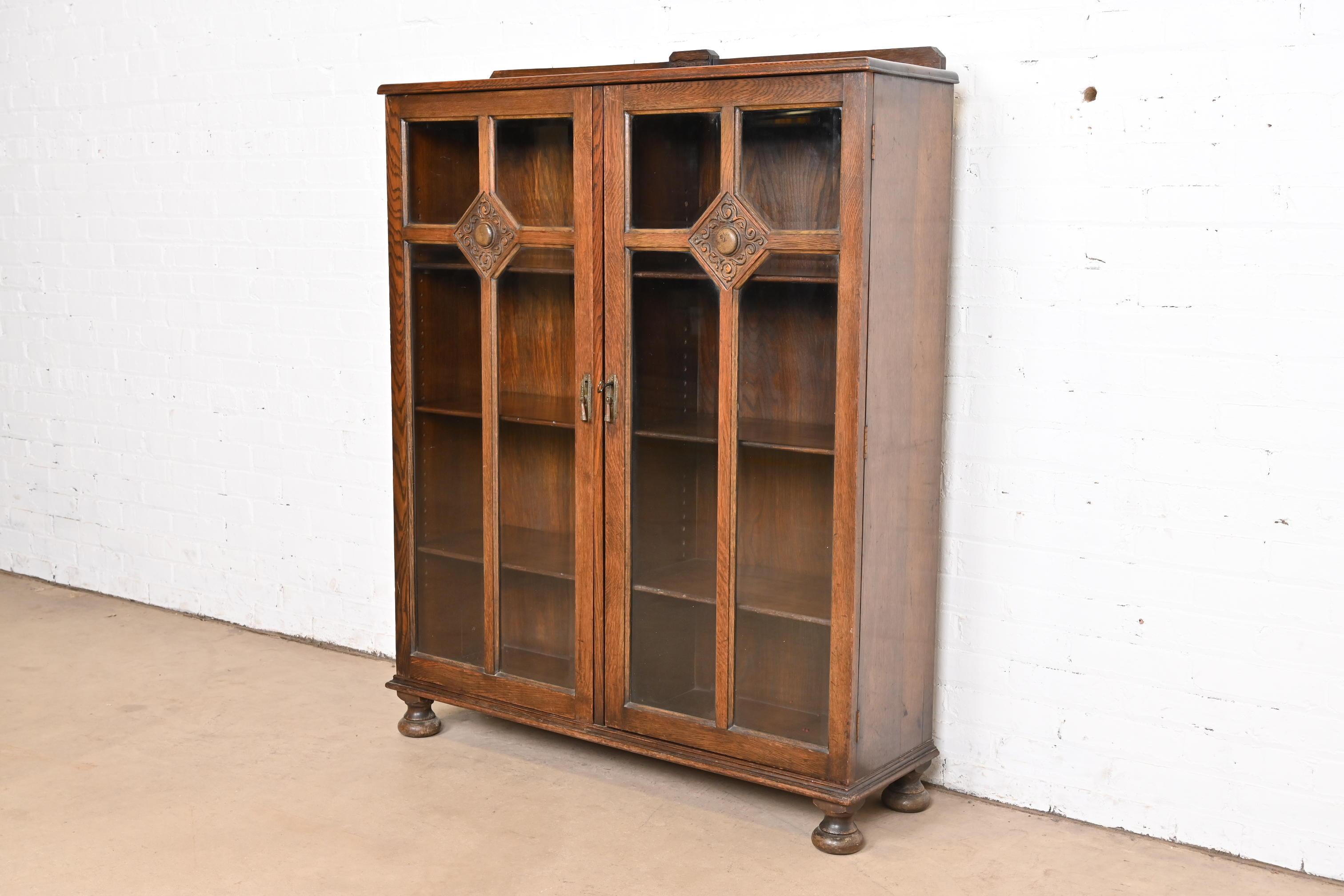 American R. J. Horner Style Antique English Tudor Carved Oak Glass Front Double Bookcase
