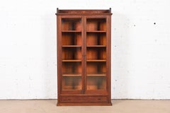 R. J. Horner Style Antique Victorian Carved Mahogany Glass Front Double Bookcase
