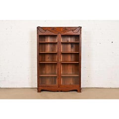 R. J. Horner Style Antique Victorian Carved Oak Bookcase, Circa 1890s