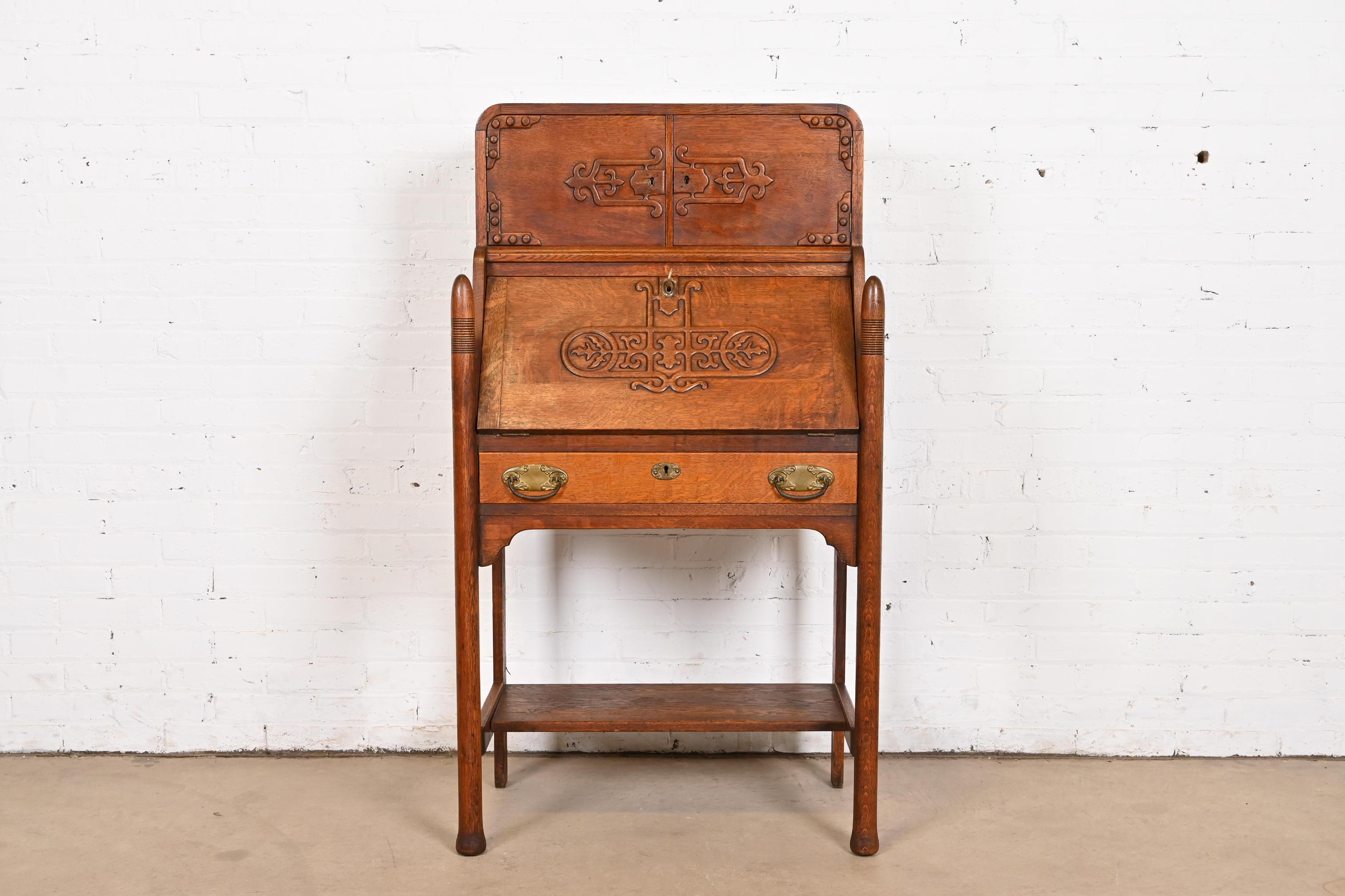 A gorgeous antique Victorian or Arts & Crafts slant front writing desk

In the manner of R.J. Horner & Co.

USA, Circa 1890s

Carved quarter sawn oak, with original brass hardware. Desk locks, and key is included.

Measures: 29