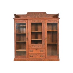 R. J. Horner Style Antique Victorian Carved Oak Triple Bookcase, Circa 1880s
