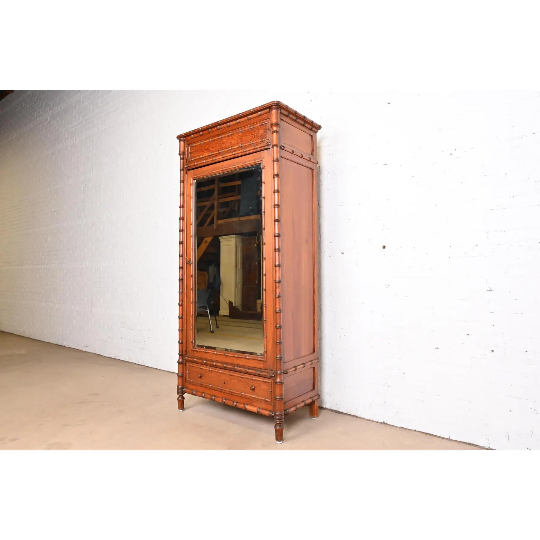 A gorgeous antique Victorian armoire dresser, linen press, or gentleman's chest

In the manner of R.J. Horner & Co.

USA, Circa 1890s

Carved pine, with faux bamboo trim, and beveled mirror door front. Cabinet locks, and key is included. Interior
