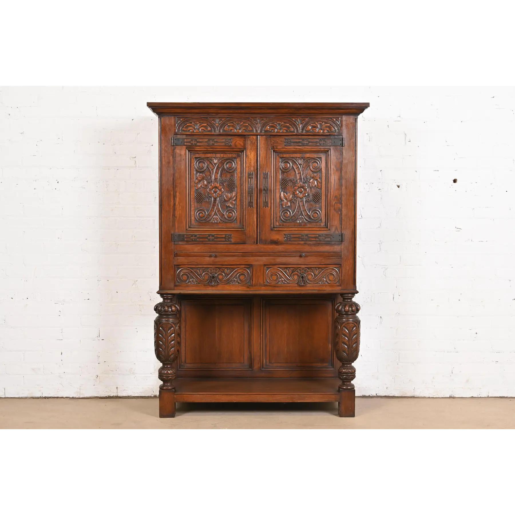 American R. J. Horner Style English Jacobean Carved Oak Bar Cabinet, Circa 1900 For Sale