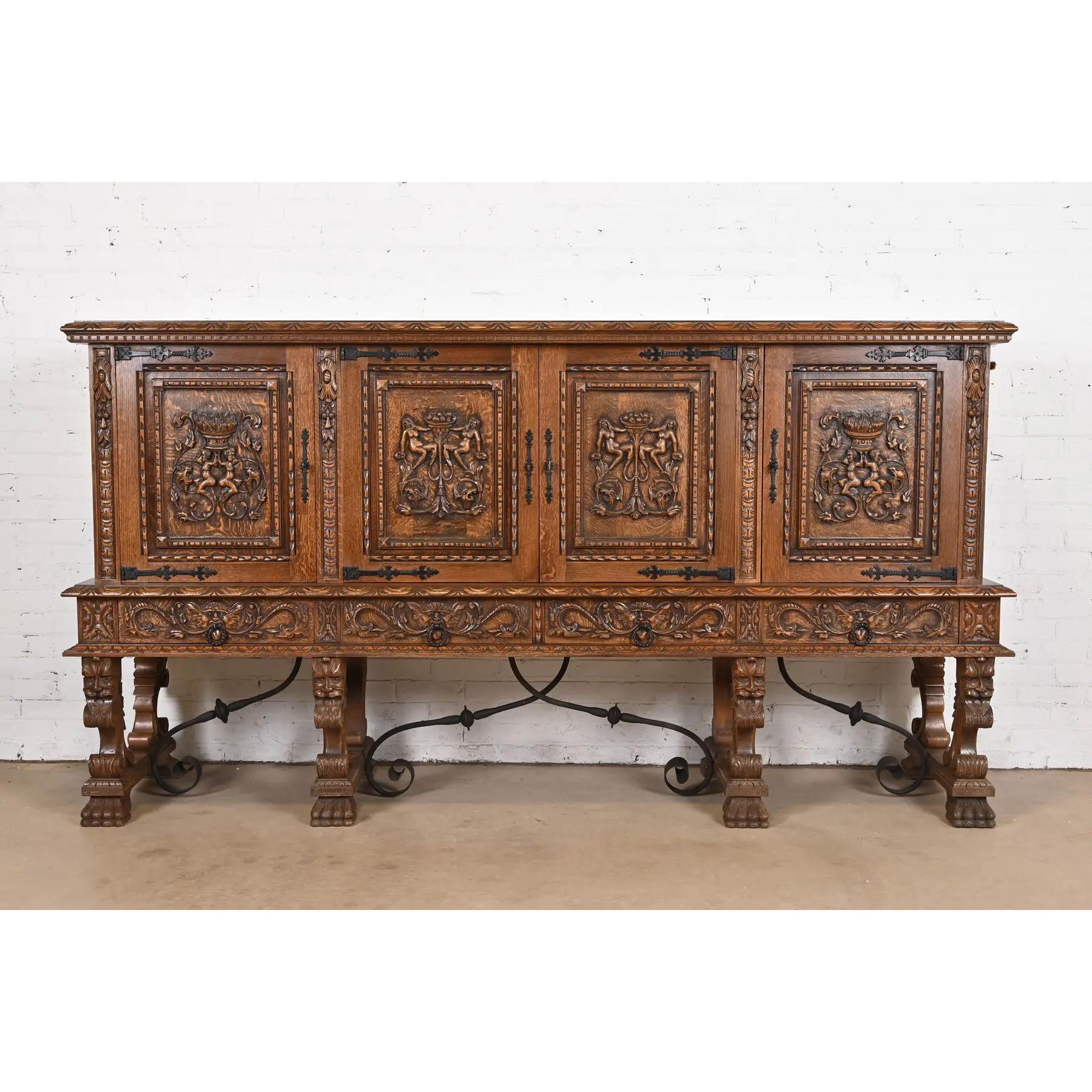 An exceptional Victorian or Renaissance Revival style sideboard, credenza, or bar cabinet

In the manner of R.J. Horner & Co.

By N.F. Ameublement

France, 20th Century

Quarter sawn oak, with carved figures and faces, paw feet, and iron hardware