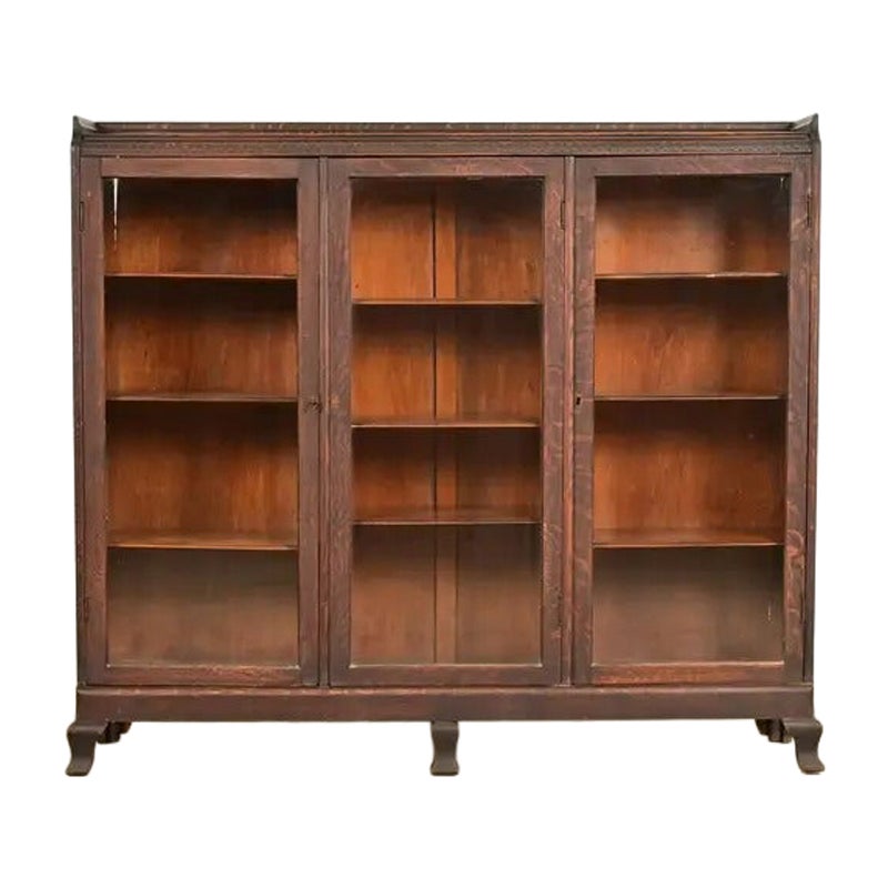R. J. Horner Style Victorian Carved Oak Glass Front Triple Bookcase, Circa 1890s