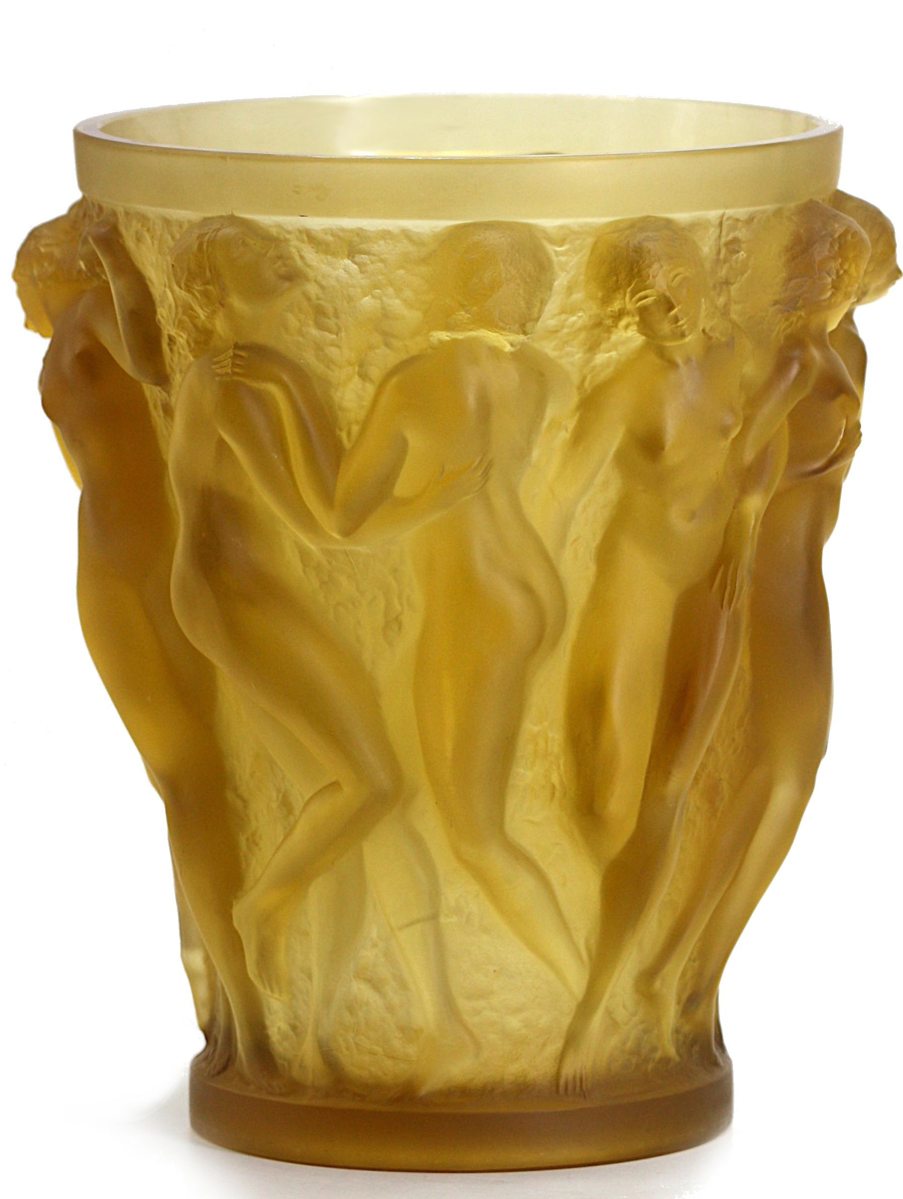R. Lalique Rare e importanti Baccanti in ambra gialla di Rene Lalique 

René Lalique (1860 - 1945)
Baccanti
Vaso in vetro giallo ambrato di Rene Lalique con dieci figure femminili nude in altorilievo su una base in bronzo autoilluminante, fusa con