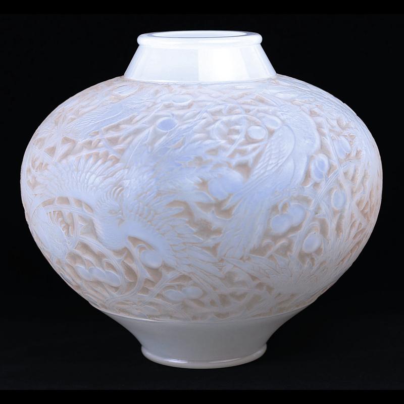 Offering this original Rene Lalique “Aras” mold-blown white opalescent vase or lamp base. This vase or lamp base features an all-over, stylized, patinated or stained bird and foliage design with excellent relief and detail. Drilled on the underside