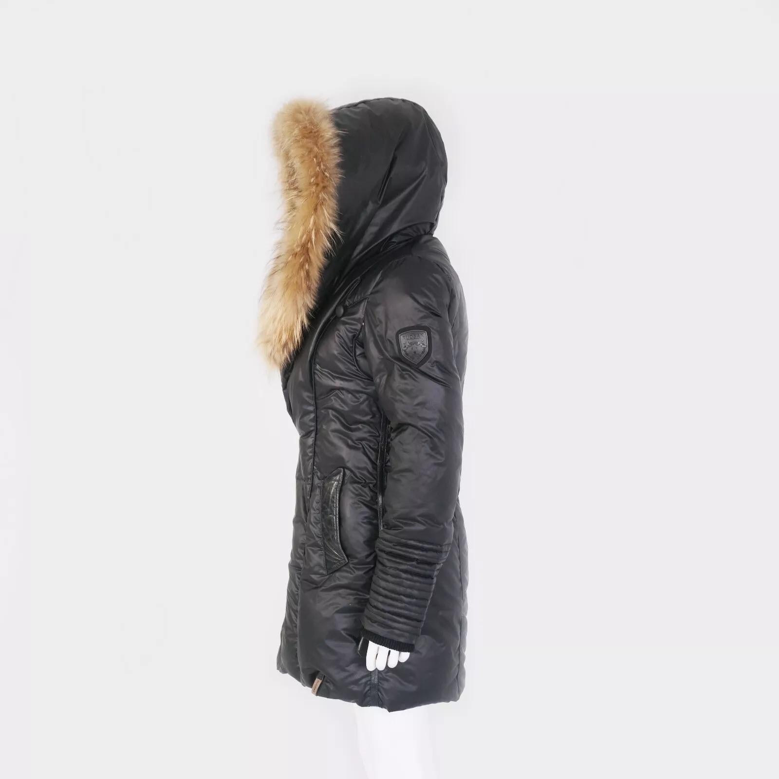 Experience the epitome of warmth and style with the RUDSAK Sophie Black Women's Winter Jacket. Crafted from premium polyester, this jacket offers both durability and comfort, making it an essential addition to your cold-weather wardrobe. Its sleek