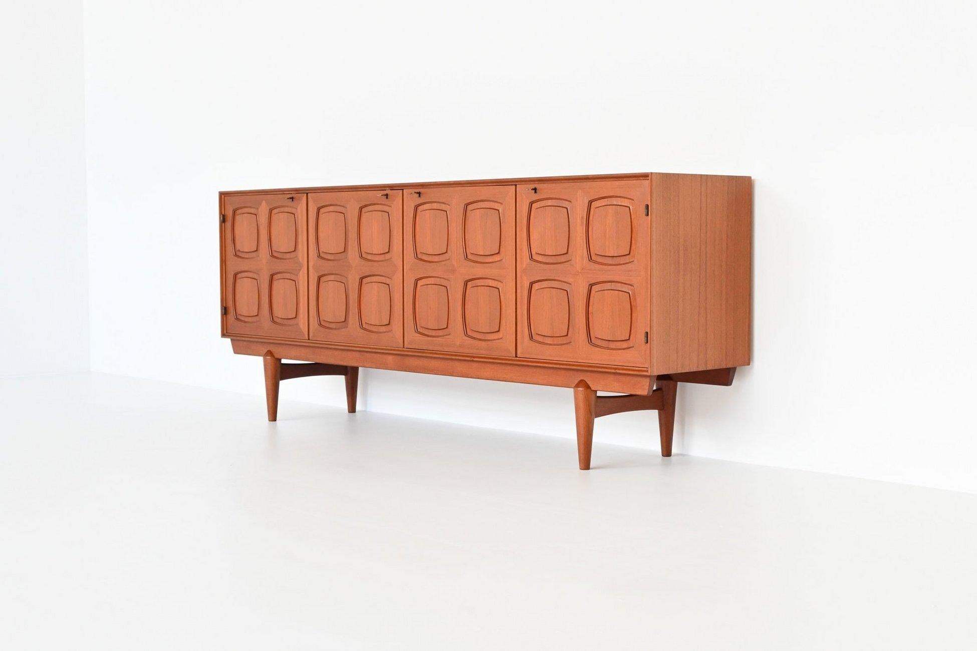 Beautiful and very rare sideboard designed by Rolf Rastad & Arnold Relling for Gustav Bahus, Norway 1960. This high quality Scandinavian cabinet is executed in teak wood supported by a solid frame. It has four massive doors with a very nice graphic