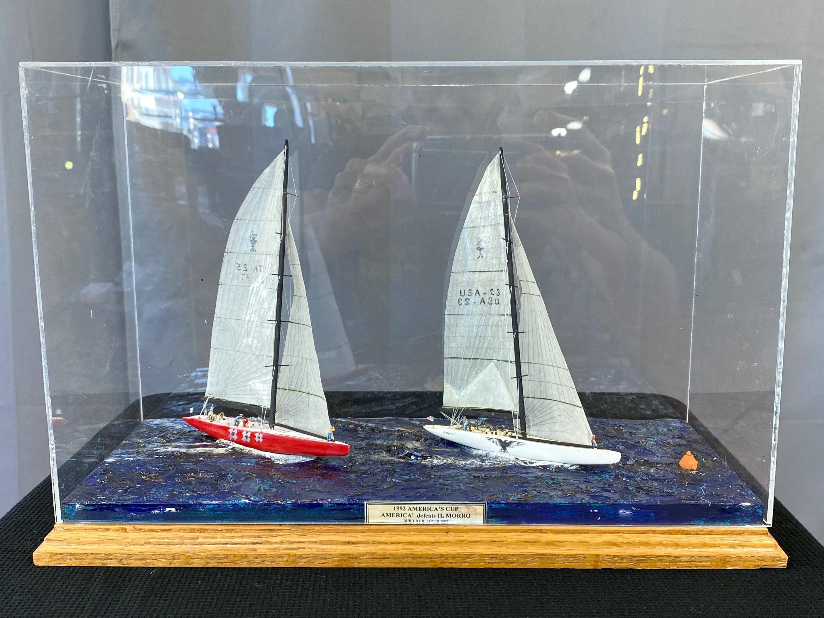 A highly detailed and dynamic hand-built diorama by R. Royer depicting an exciting moment from the 1992 28th America’s Cup between winning yacht America³ and her challenger Il Moro di Venezia.

Both racers are finely crafted and faithfully