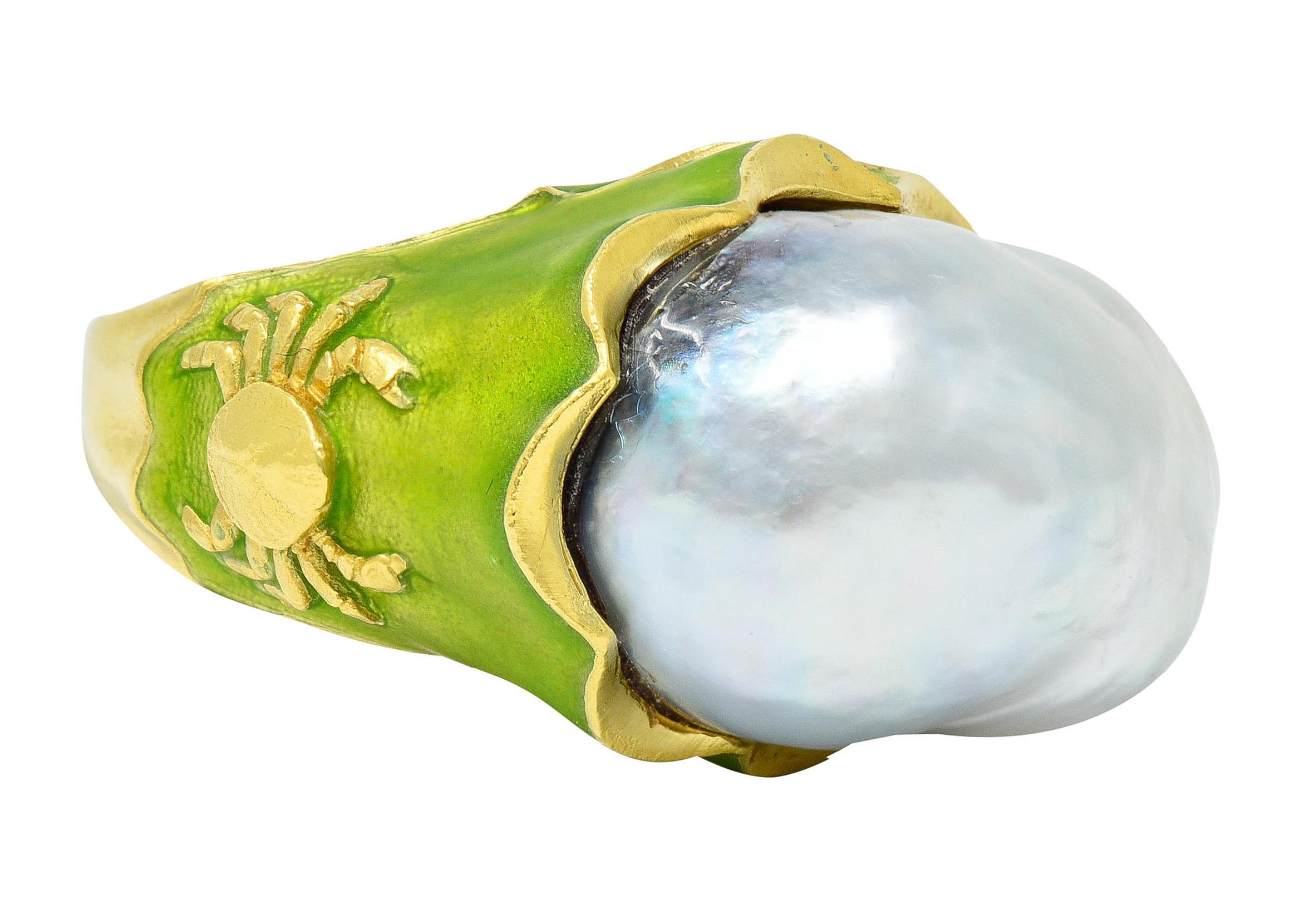 Ring centers a substantial baroque pearl measuring approximately 16.3 x 21.0 mm

Gray in body color with strong iridescence and excellent luster

Belcher set in a stylized mount accented by highly rendered motifs of a crab and sea horses

Glossed