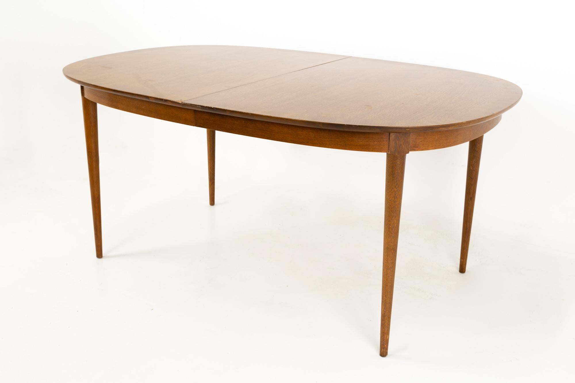 R-Way mid century walnut inlaid rounded oval 10 person dining table
Without leaves this table is 64 wide x 42 deep x 29 inches high, with a seat clearance of 25 inches and each of the 2 leaves are 18 inches wide

All pieces of furniture can be