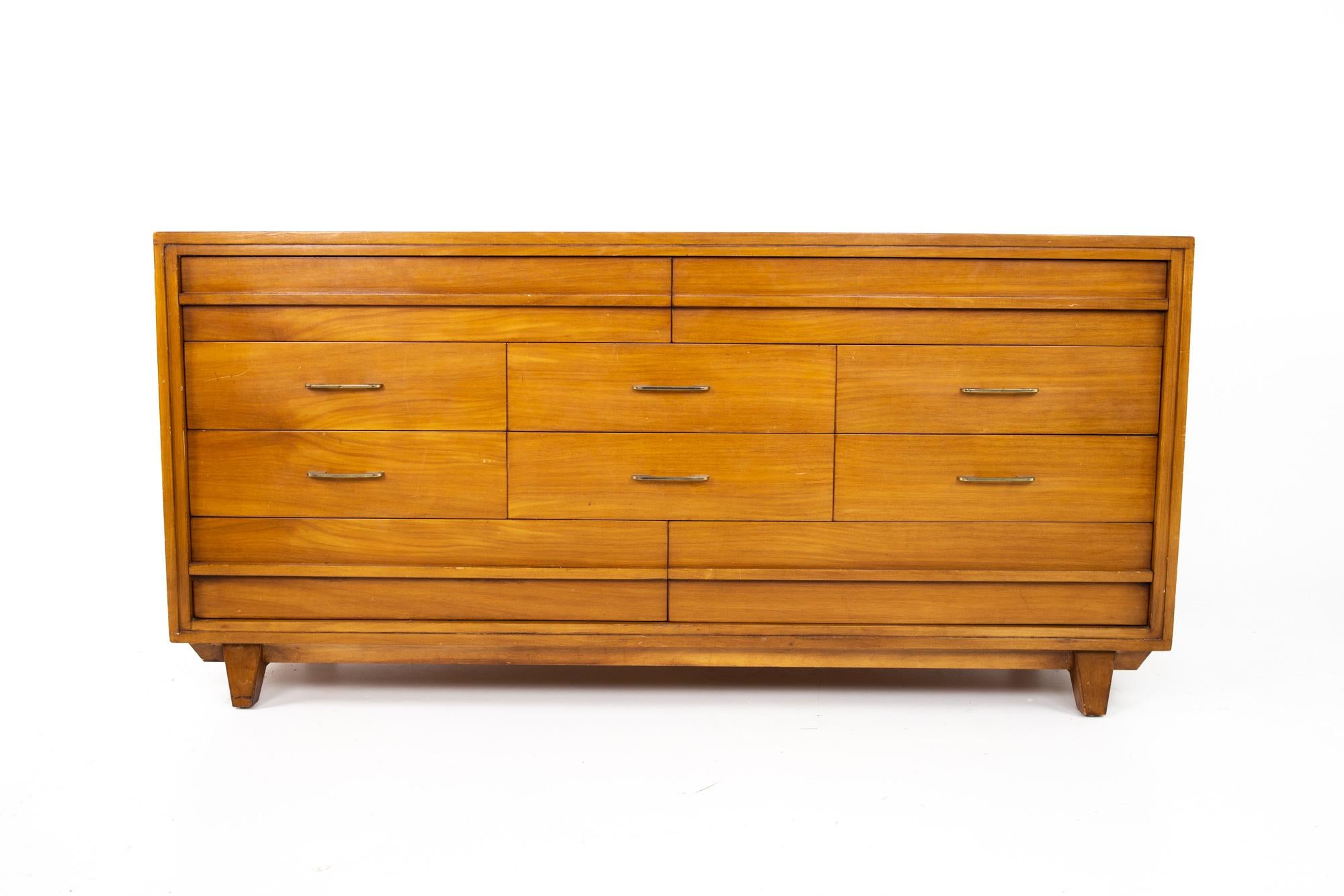 RWAY Mid Century honey walnut and brass 10-drawer lowboy dresser
Dresser measures: 69 wide x 21.5 deep x 33.5 inches high 

This price includes getting this piece in what we call restored vintage condition. That means the piece is permanently fixed