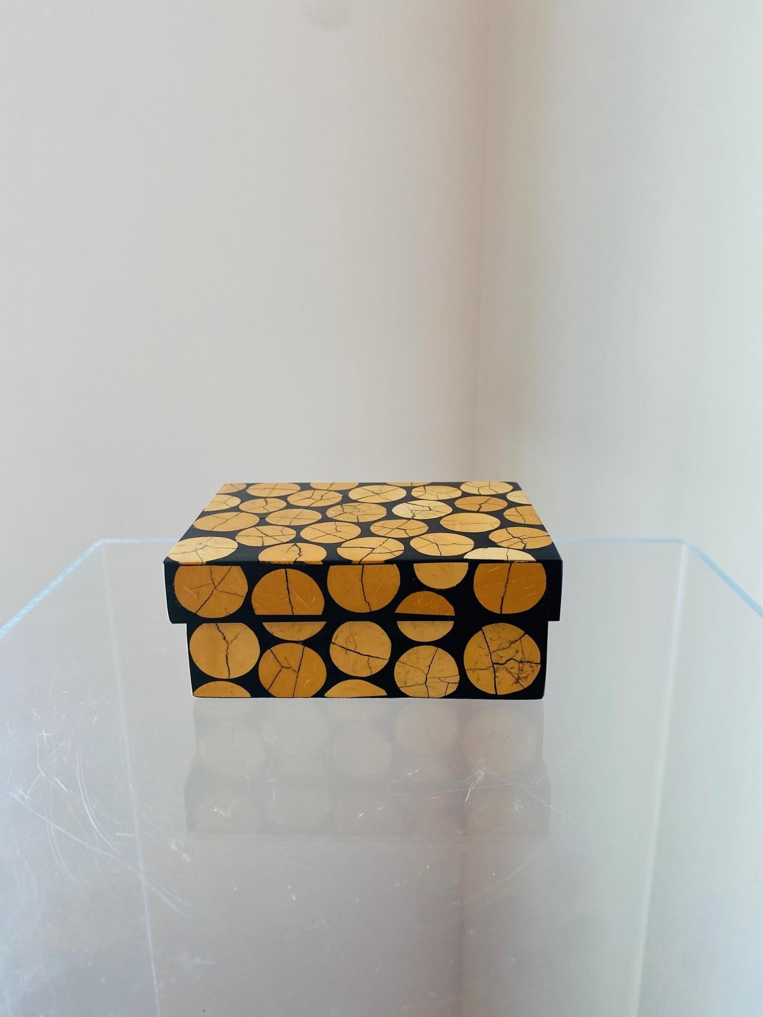 Beautiful and Minimalist trinket box by R Y Augousti. This rare beauty is a unique trinket box or decorative box that brings minimal shape with organic beauty. Constructed of wood panels that have been lacquered, the piece has aged beautifully and