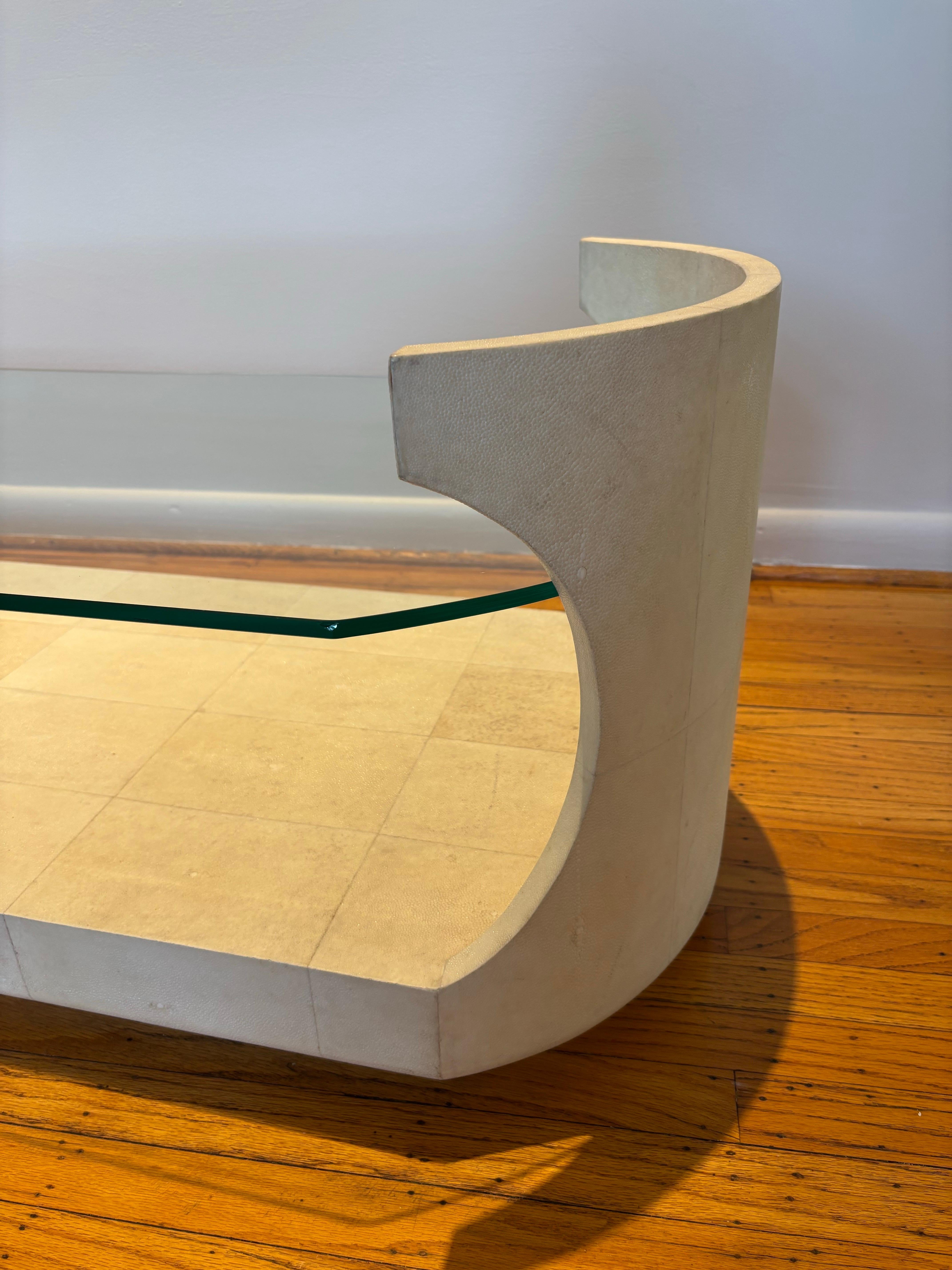 R & Y Augousti Shagreen and Glass Surfboard Shaped Coffee Table.  Couple living in Paris bought new in the 90's and moved to Philadelphia area.  Overall in nice original condition, with just a little edge wear at top points of wood covered skin. 