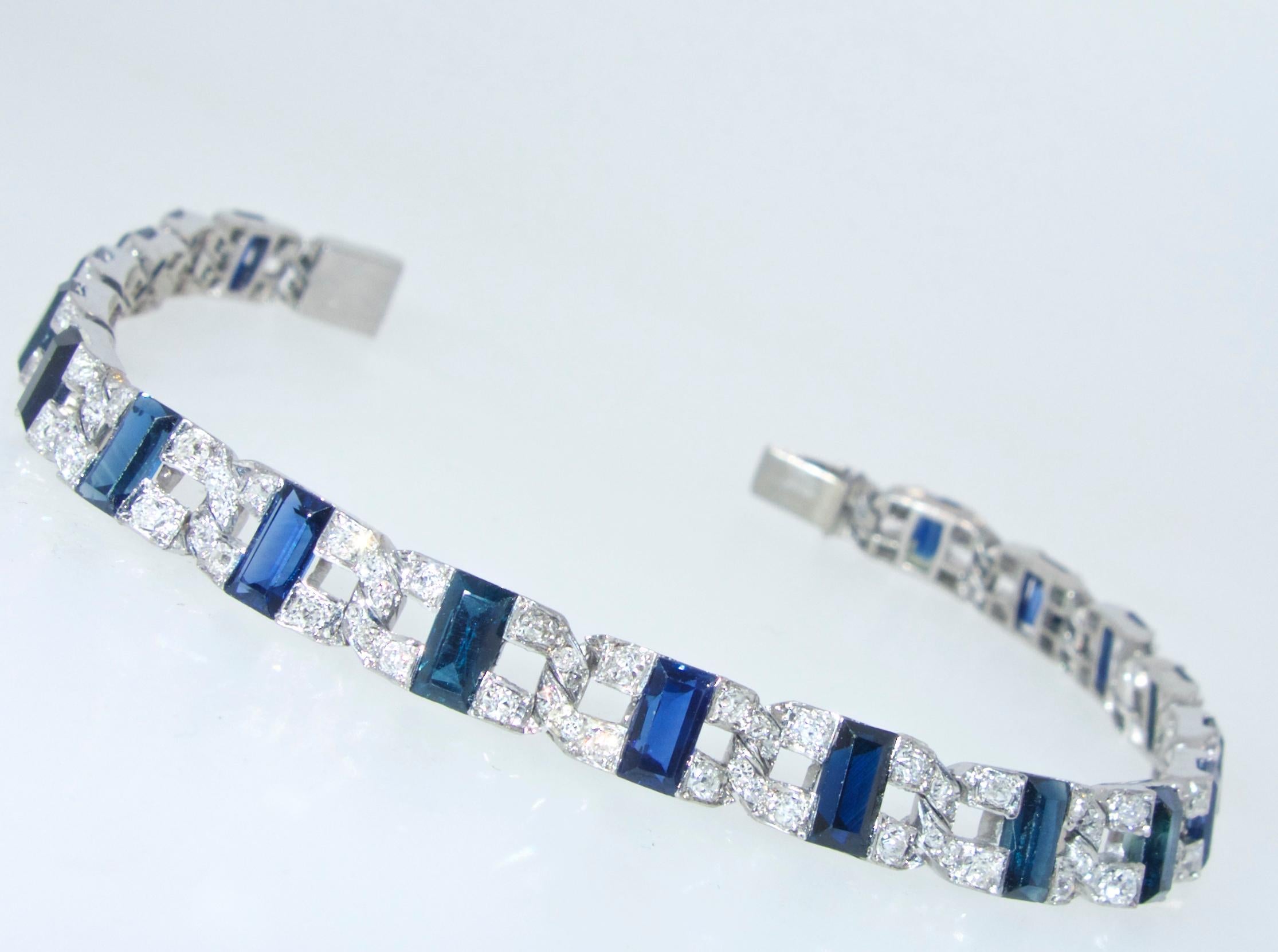 Vintage Fine sapphires and diamonds create a geometric pattern around the wrist.  The 20 fine blue natural sapphires weigh approximately 6 cts., the 150 white round diamonds weigh approximately 1.50 cts.  This platinum bracelet weighs 19.4 grams and