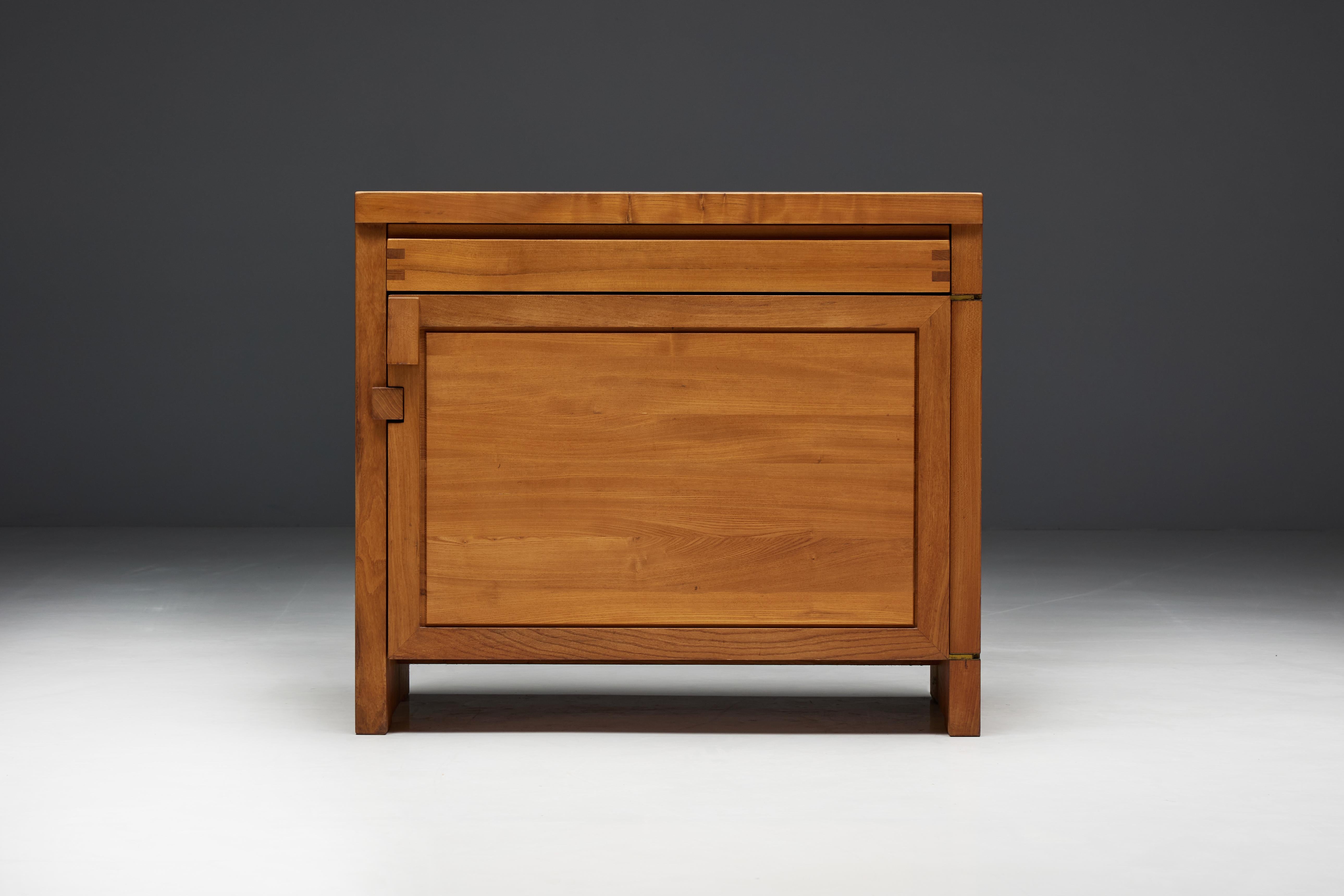 R09B cabinet by Pierre Chapo, a rare gem from 1970s France. Crafted with precision from solid elm, this small cabinet is adorned with remarkable joint connections that showcase the masterful artistry of Pierre Chapo. The charming patina enhances the