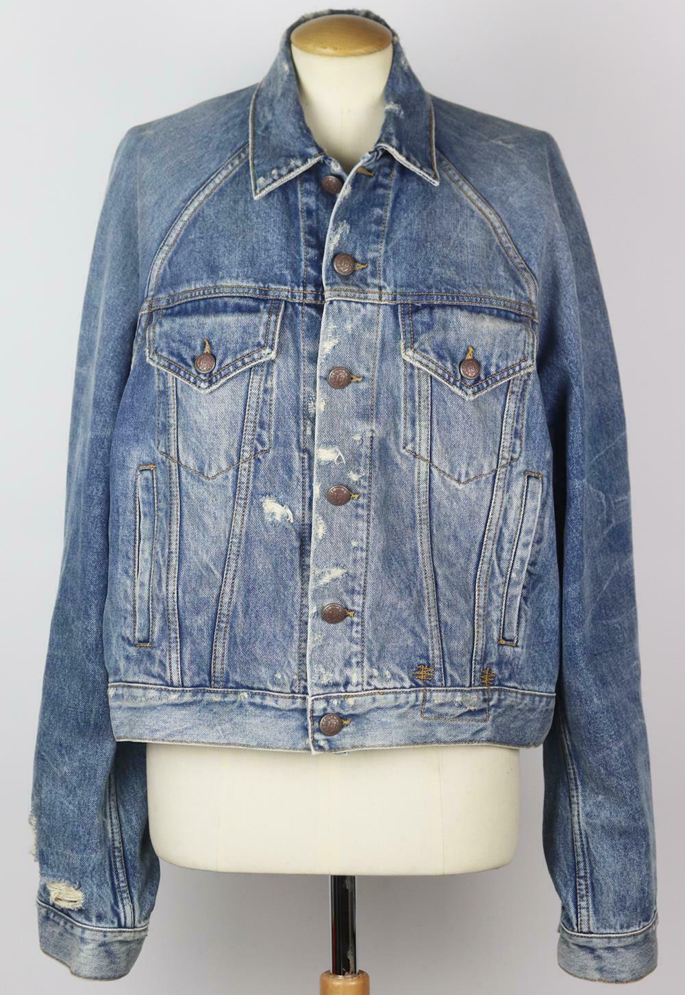 Inspired by classic trucker styles, R13's denim jacket has a cool, oversized fit, it's made from faded blue denim that's heavily distressed and trimmed with embossed buttons.
Blue denim.
Button fastening at front. 
100% Cotton; trim: 100% leather
