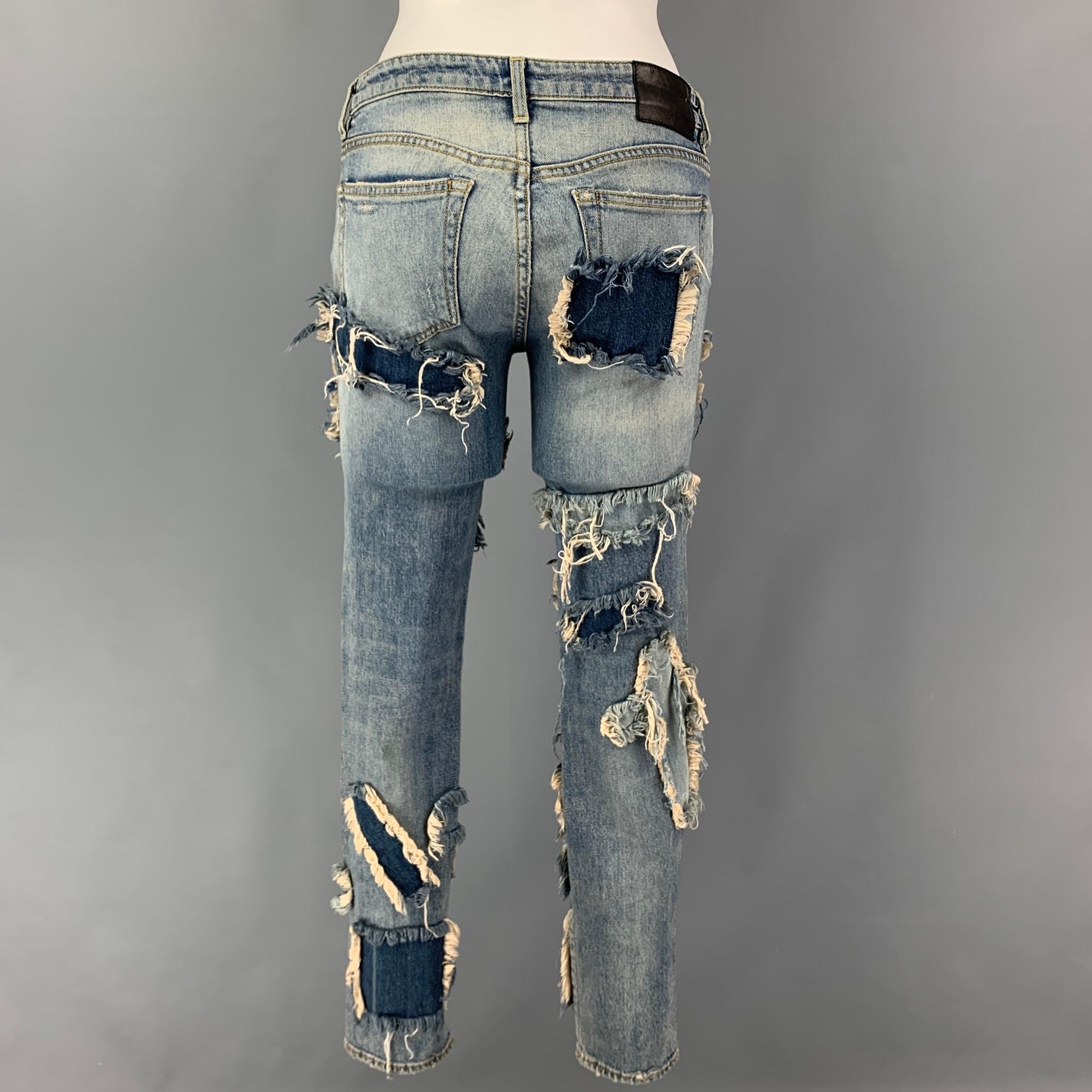 R13 jeans comes in a blue indigo denim featuring a skinny fit, distressed details throughout, contrast stitching, and a zip fly closure. Made in Italy.

Very Good Pre-Owned Condition.
Marked: 26

Measurements:

Waist: 28 in.
Rise: 9 in.
Inseam: 29