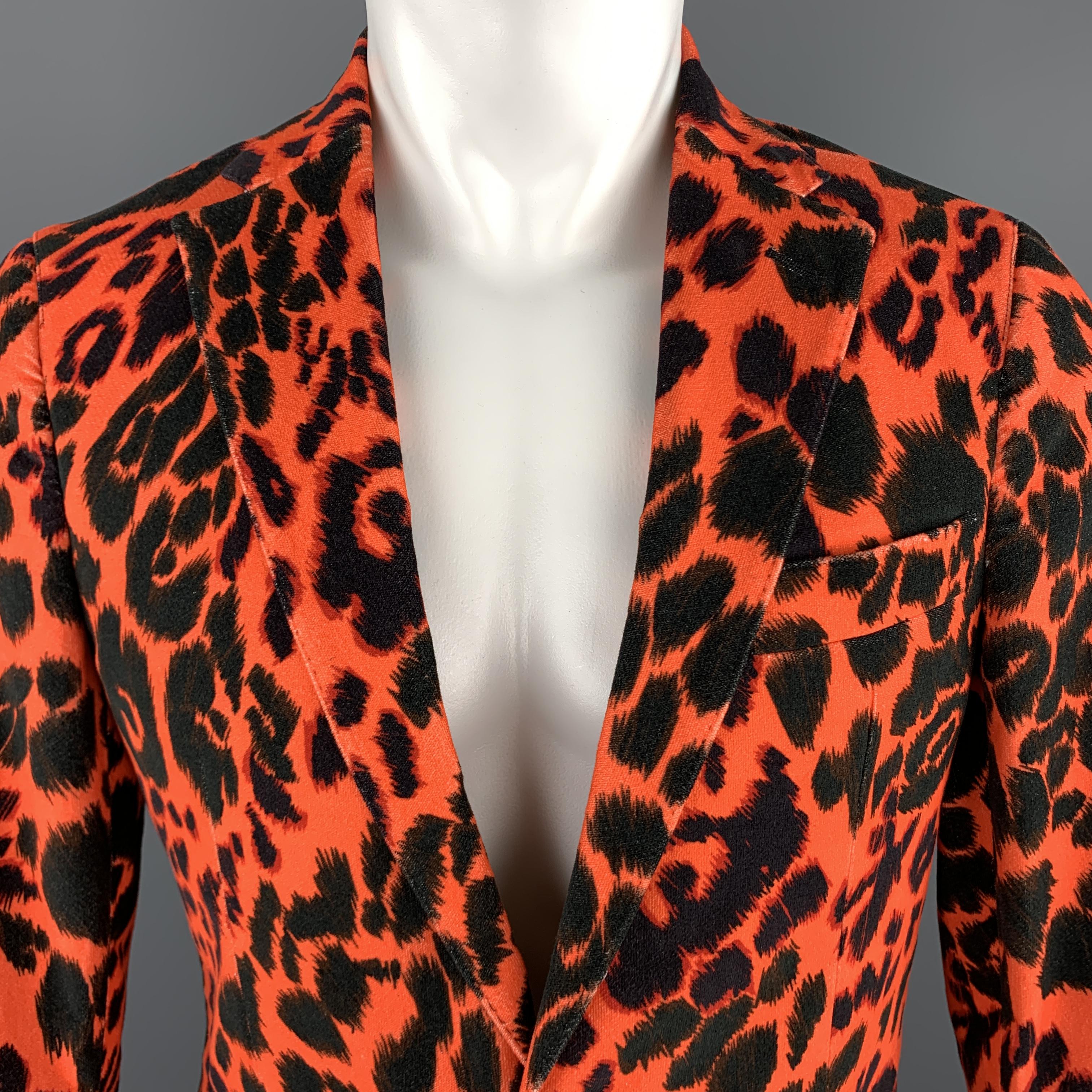 R13 sport coat comes in vibrant orange and black retro leopard printed cotton velvet with a notch lapel, single breasted, two button front, and functional button front. Made in USA.

Excellent Pre-Owned Condition. 
Marked: US 38 REG
Original Retail