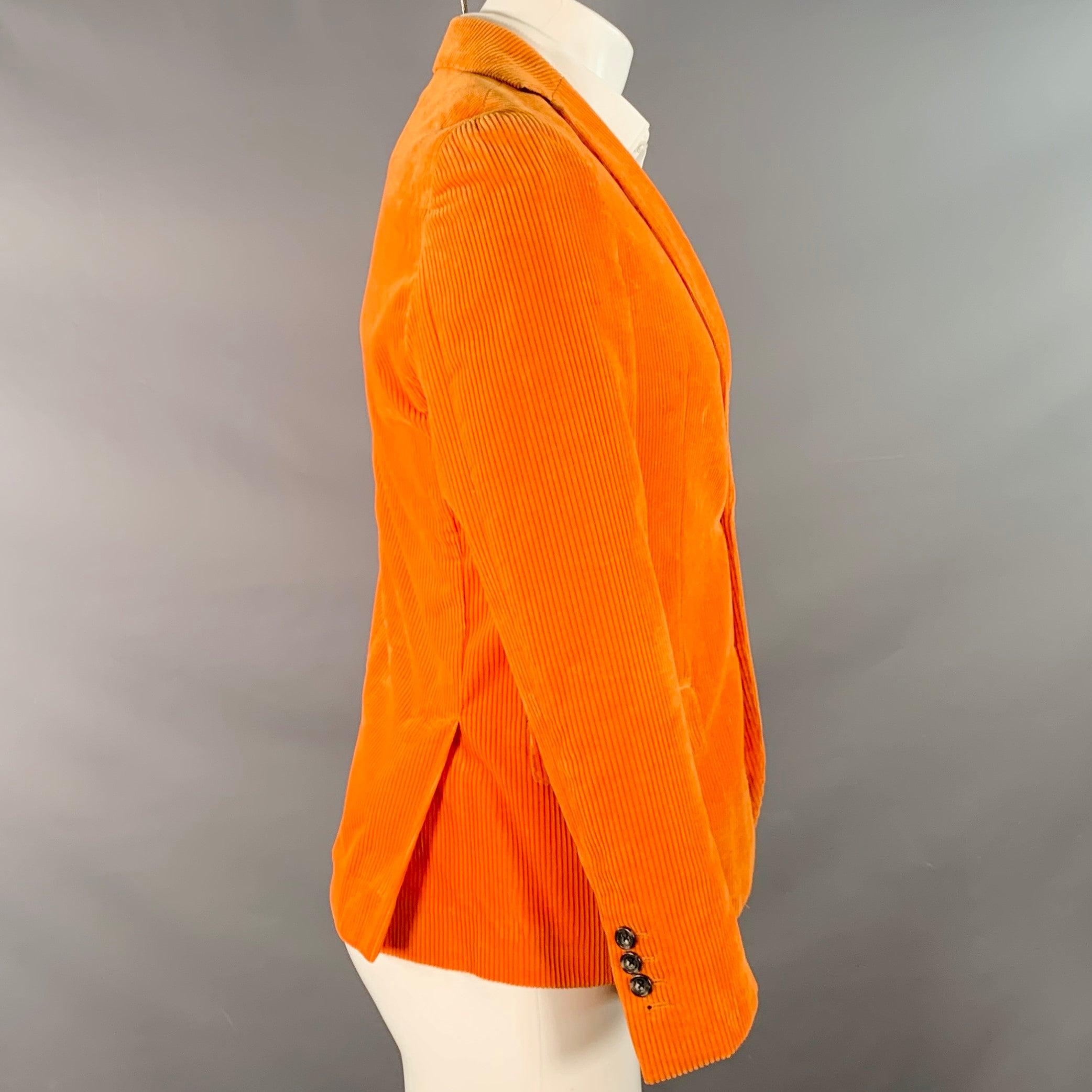 R13 sport coat
in an orange cotton corduroy with half lining featuring a notch lapel, double vented back, and double button closure. Made in USA.Excellent Pre-Owned Condition. 

Marked:   38R 

Measurements: 
 
Shoulder: 16 inches Chest: 38 inches
