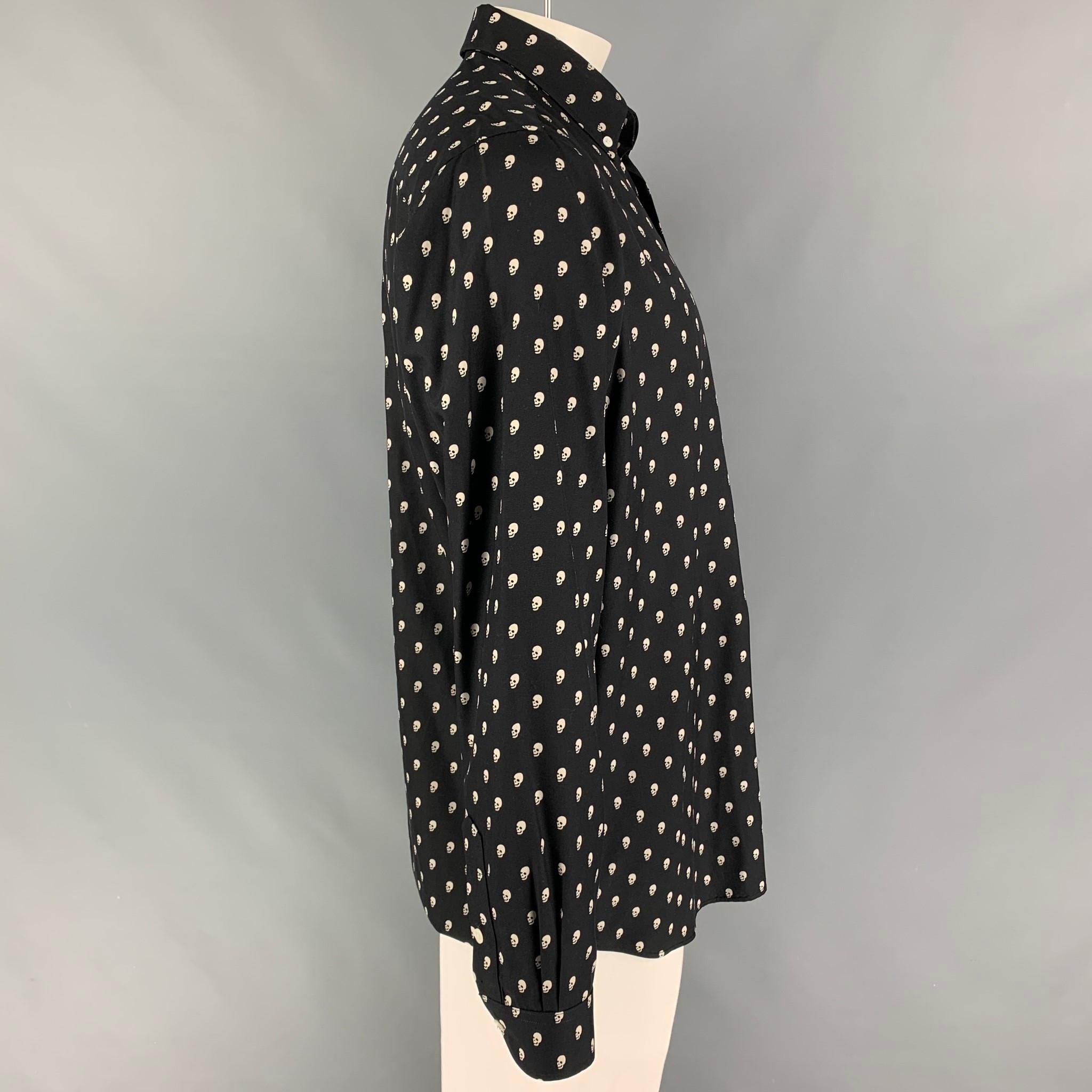 R13 long sleeve shirt comes in a black & white skull print silk featuring a button down collar, patch pocket, and a button up closure. Made in USA.

Excellent Pre-Owned Condition.
Marked: L

Measurements:

Shoulder: 19 in.
Chest: 48 in.
Sleeve: 27.5