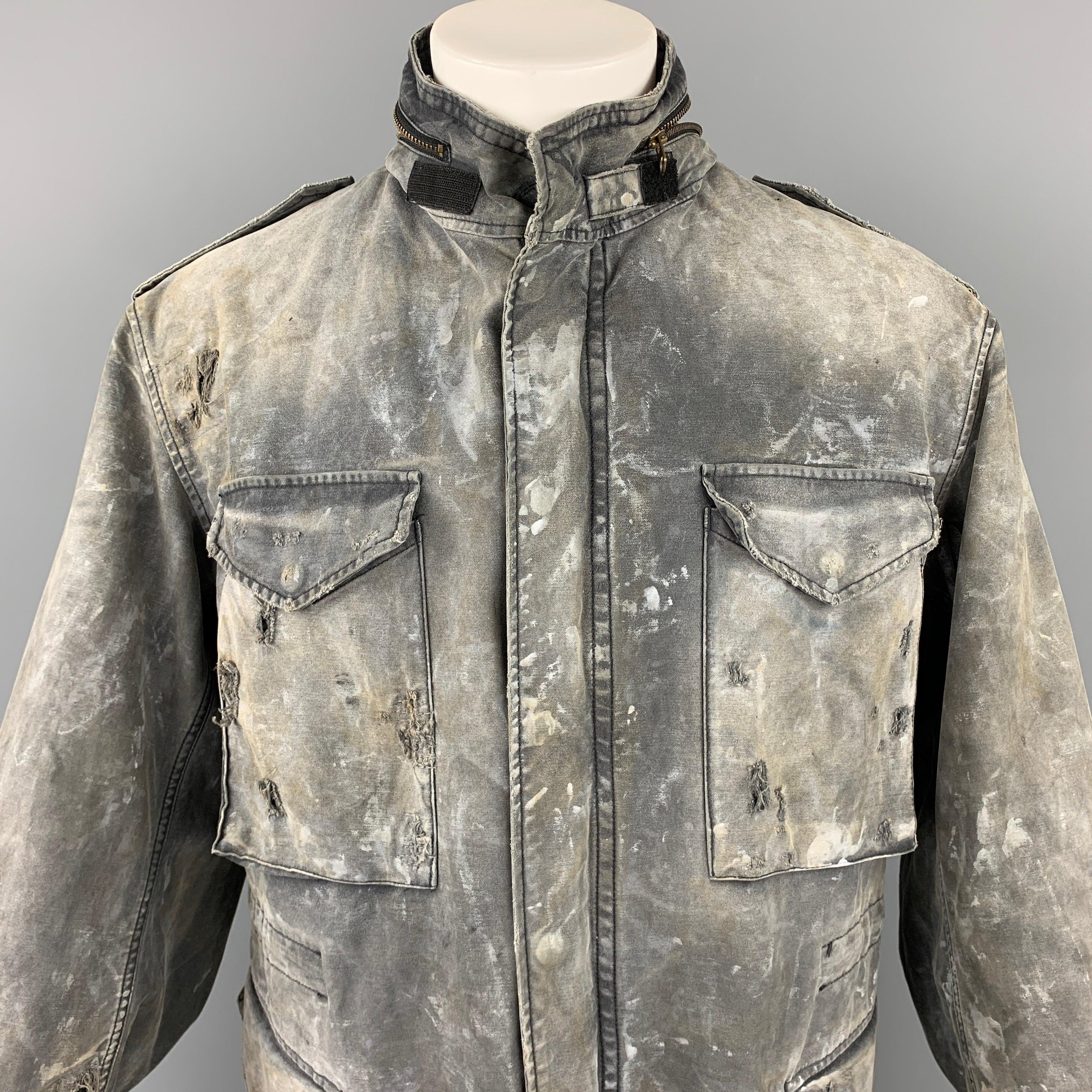 R13 jacket comes in a gray distressed cotton with a full liner featuring a destroyed military style, hooded, patch pockets, epaulettes, and a snap button closure. Made in Italy.
Very Good
Pre-Owned Condition. 

Marked:   M 

Measurements: 
