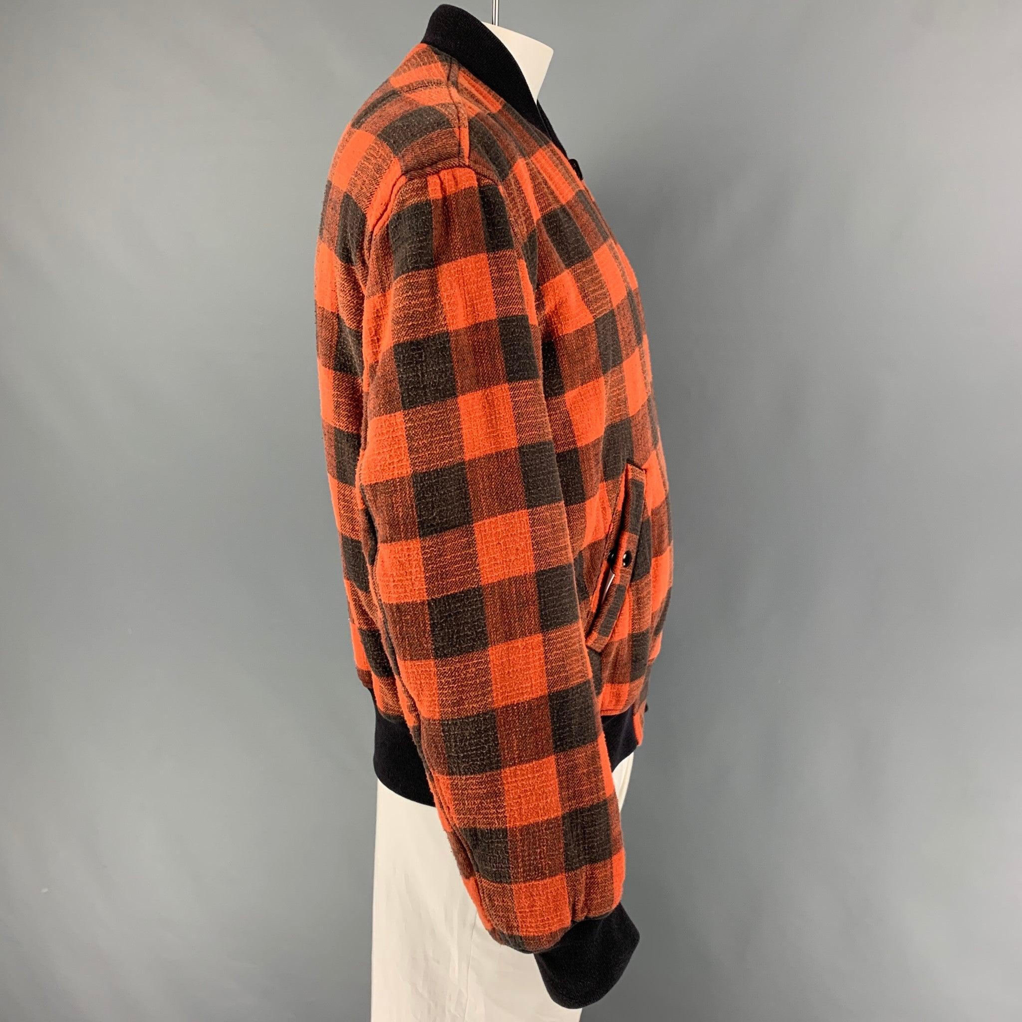 R13 jacket comes in a orange & black plaid cotton featuring a reversible style, oversized, bomber, ribbed hem, front pockets, and a full zip up closure.
Very Good
Pre-Owned Condition. 

Marked:   M 

Measurements: 
 
Shoulder: 22.5 inches  Chest: 50
