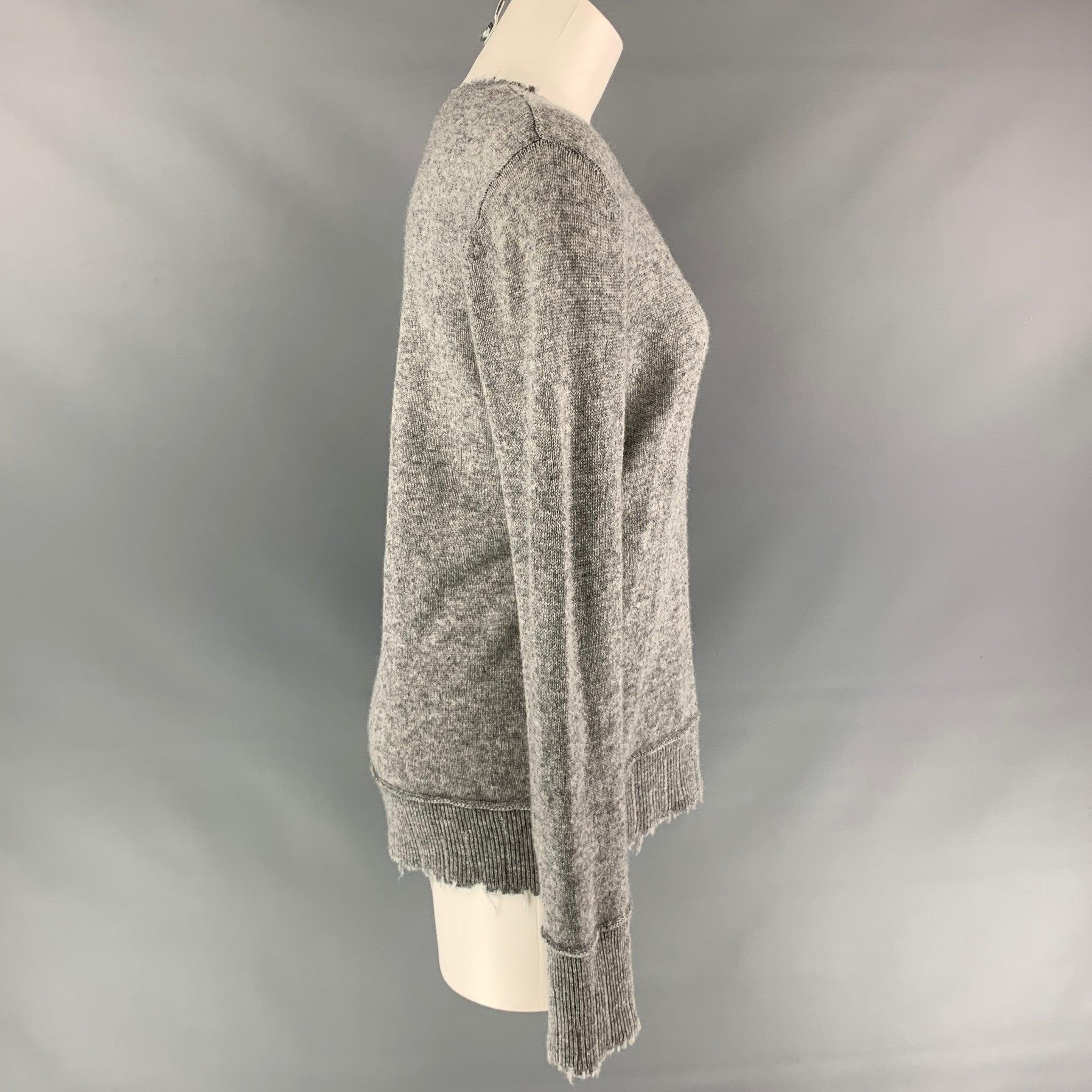 R13 sweater comes in a grey heather cashmere featuring distressed edges and a crew-neck.Very Good Pre-Owned Condition. 

Marked:   S 

Measurements: 
 
Shoulder: 17 inches  Bust: 40 inches  Sleeve: 28.5 inches  Length: 26 inches  
  
  
 
Reference: