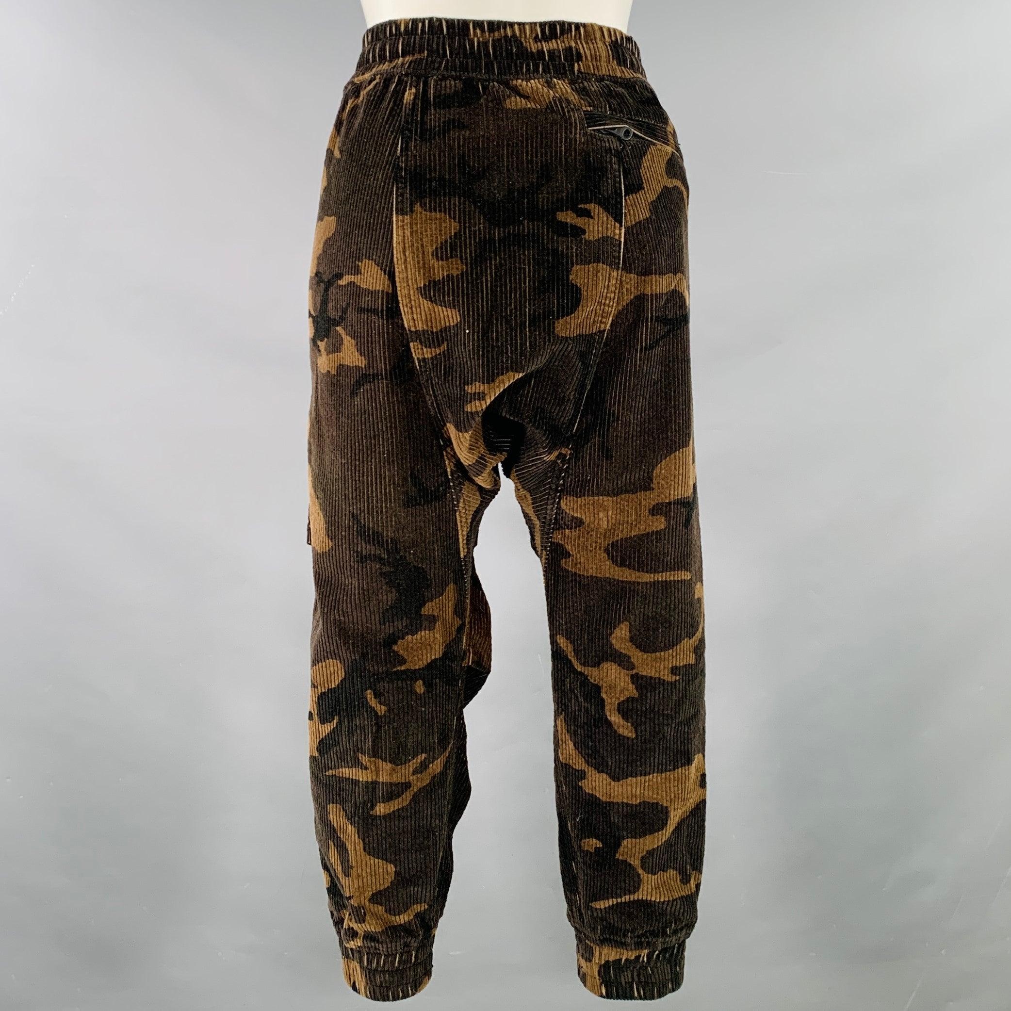 R13 casual pants
in a brown and taupe cotton corduroy featuring a camouflage pattern, drop crotch, and drawstring waistband.Excellent Pre-Owned Condition. 

Marked:   XS 

Measurements: 
  Waist: 29 - 32 inches Rise: 14 inches Inseam: 16 inches 
  
