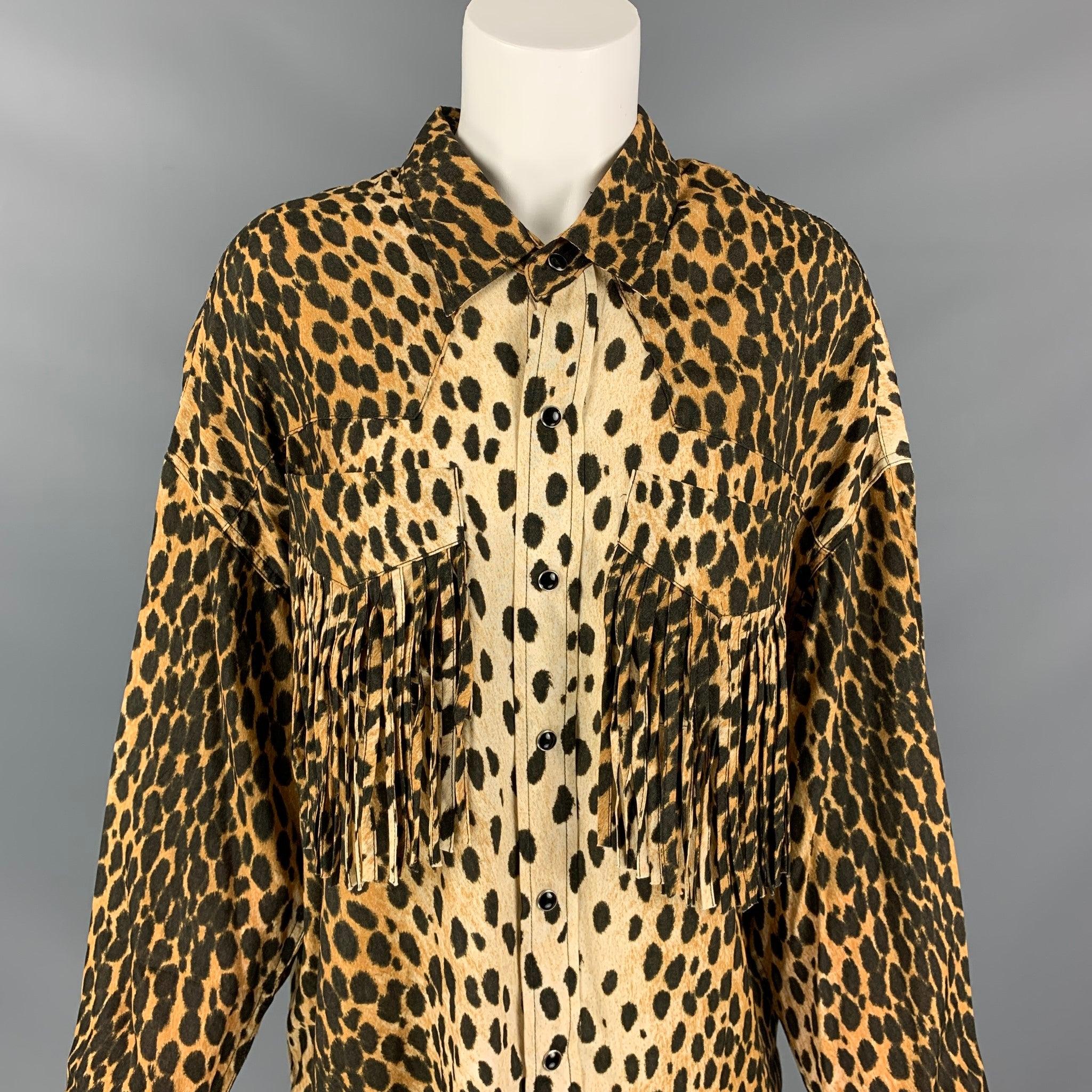 R13 shirt comes in a tan & brown animal print cotton featuring a western style, front fringe trim pockets, pointed collar, oversized fit, curved hem, and a snap button closure.
New With Tags.
 

Marked:   XS 

Measurements: 
 
Shoulder: 24 inches