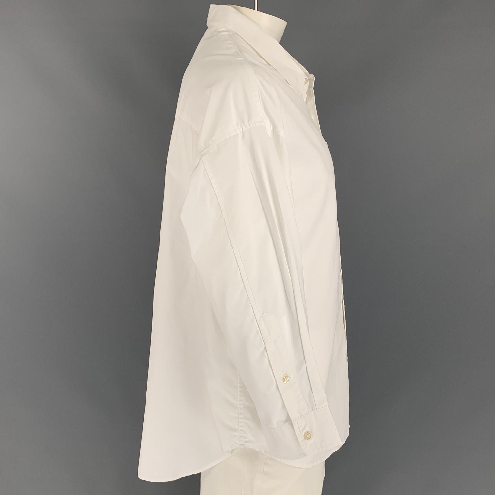 R13 long sleeve shirt comes in a white cotton featuring a oversized fit, spread collar, front pocket, and a buttoned closure.

Very Good Pre-Owned Condition.
Marked: XS

Measurements:

Shoulder: 25 in.
Chest: 48 in.
Sleeve: 20 in.
Length: 32 in. 